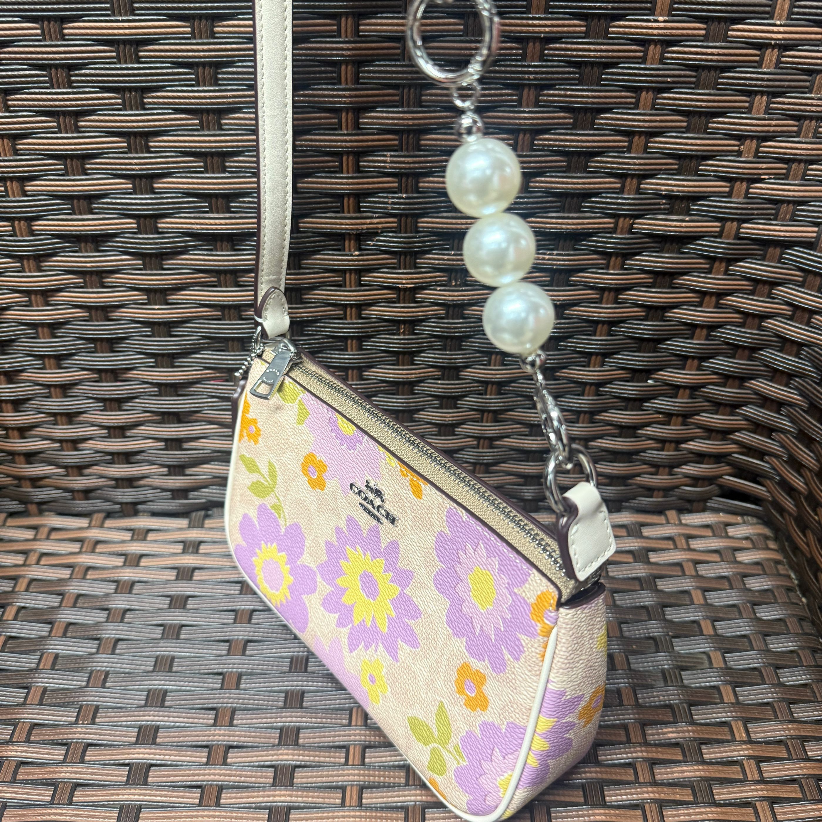 coach Nolita 19 In Signature Canvas With Floral Print cbm73