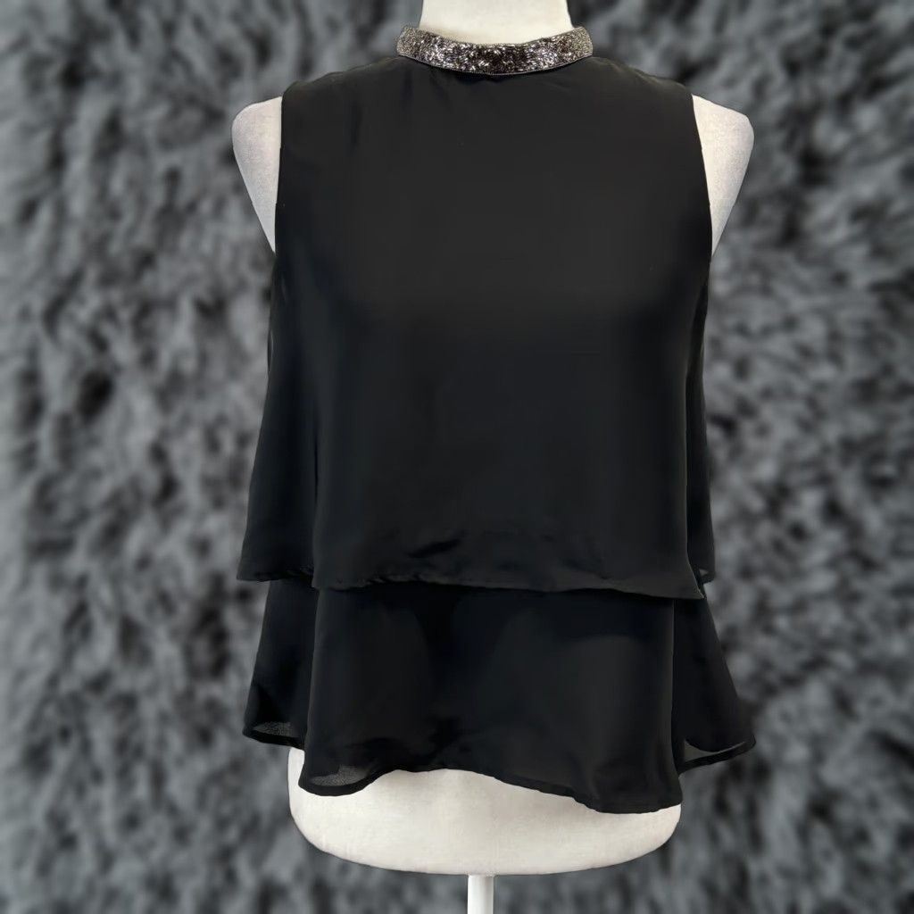 Zara VINTAGE? No. But we have Zara Basic Black Sleeveless Tiered Blouse with Silver Collar, Women, Size Small, Black, Sleeveless, Collared, Blouse. Size S / US 4 / IT 40 - 1 Thumbnail