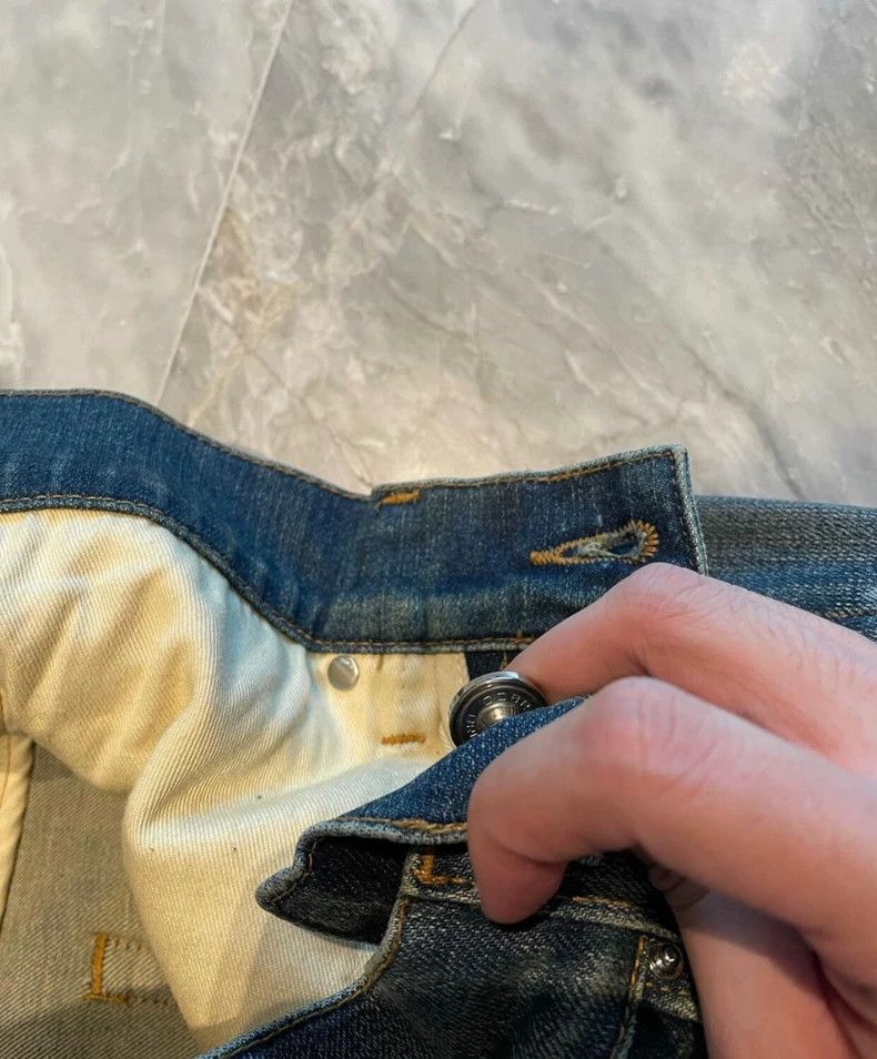 Amiri yellow mud washed blue jeans