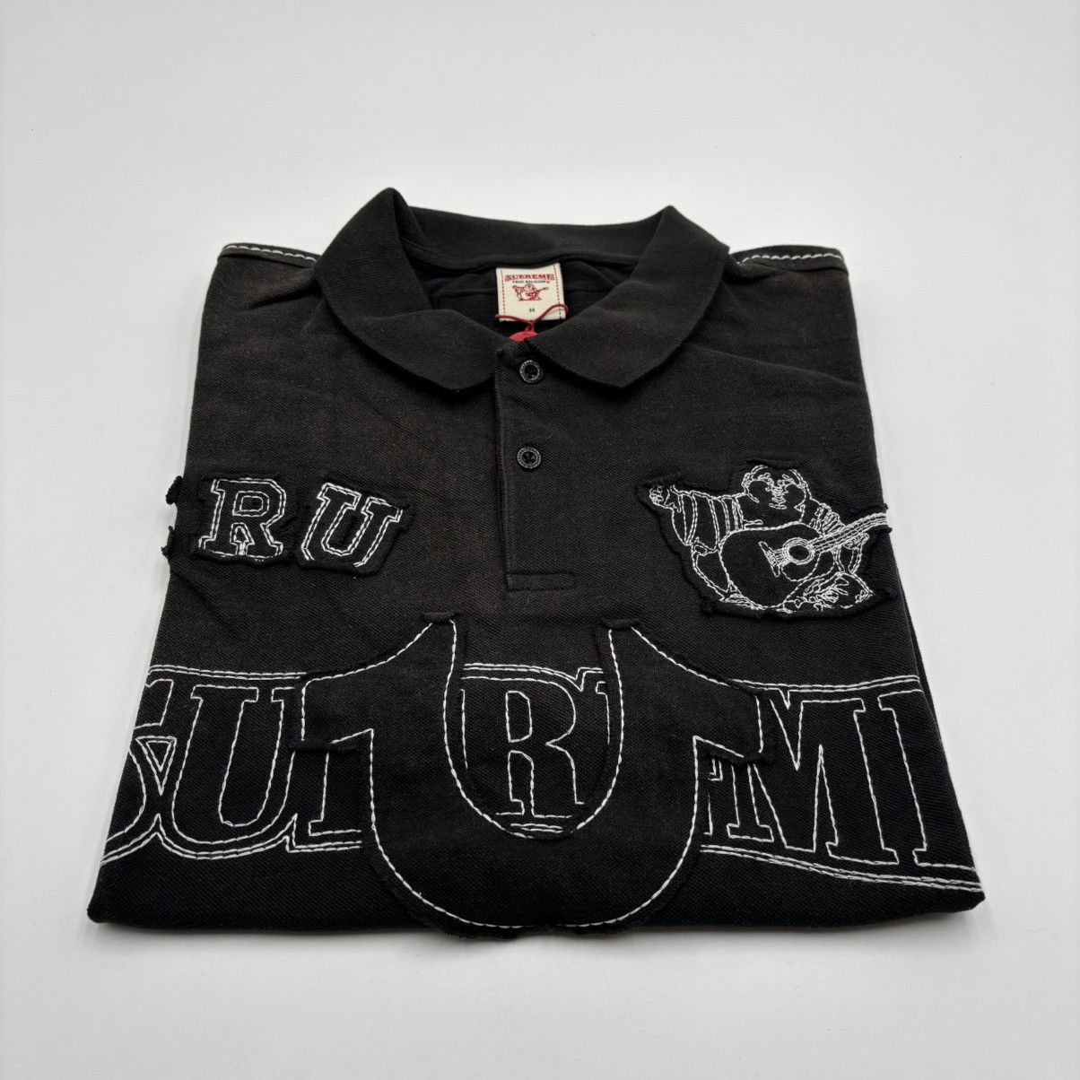 Supreme@/True Religion@ Appliqué Polo Supreme True Religion Applique Polo Woodland Camo Men's - FW25 - US