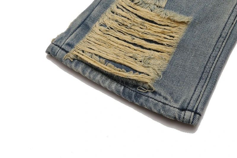 Ripped frayed hole blue washed baggy trousers jeans