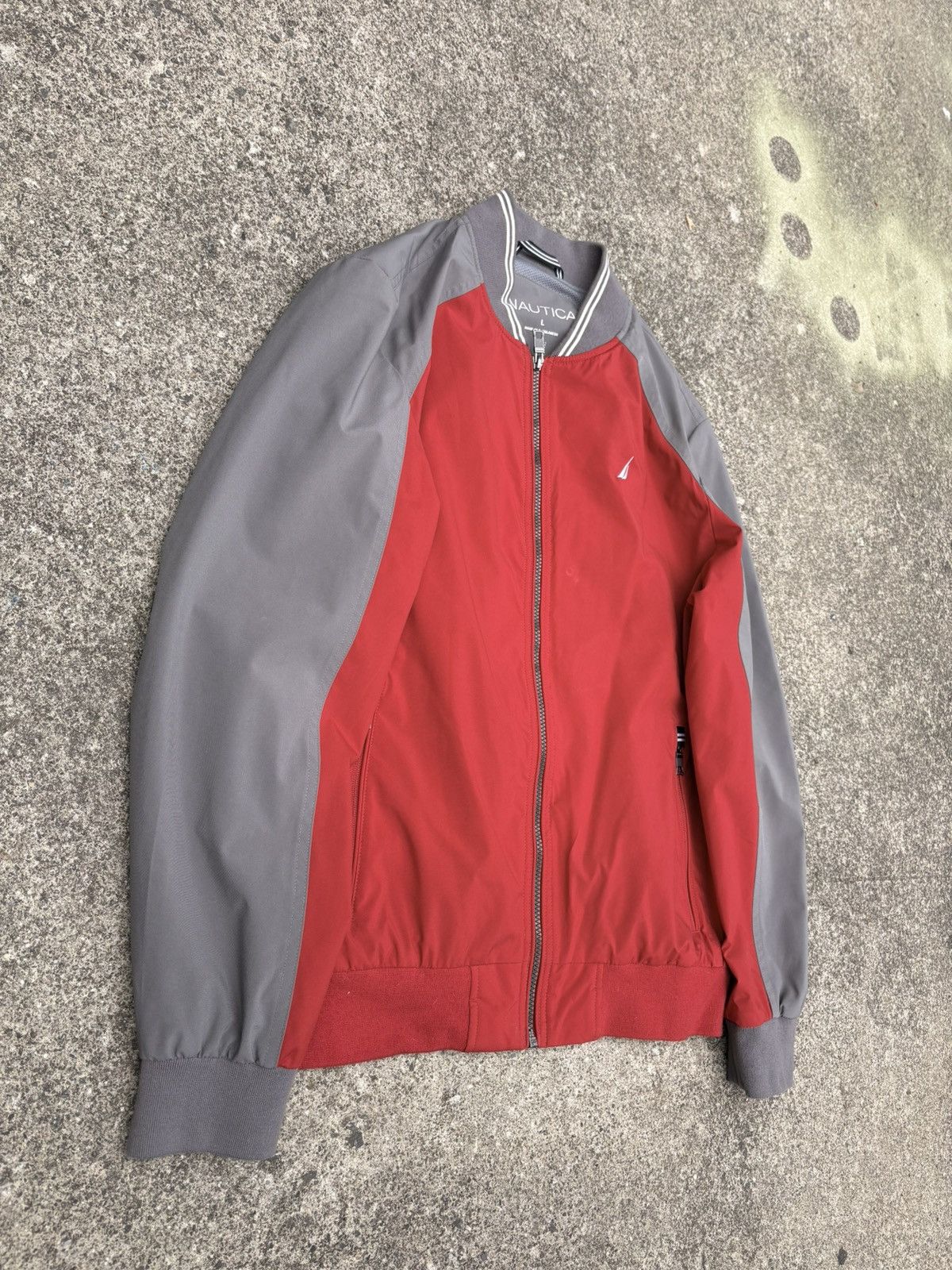 Nautica Nautica full-zip bomber in a red and grey colorblock build. Size US L / EU 52-54 / 3 - 2 Thumbnail