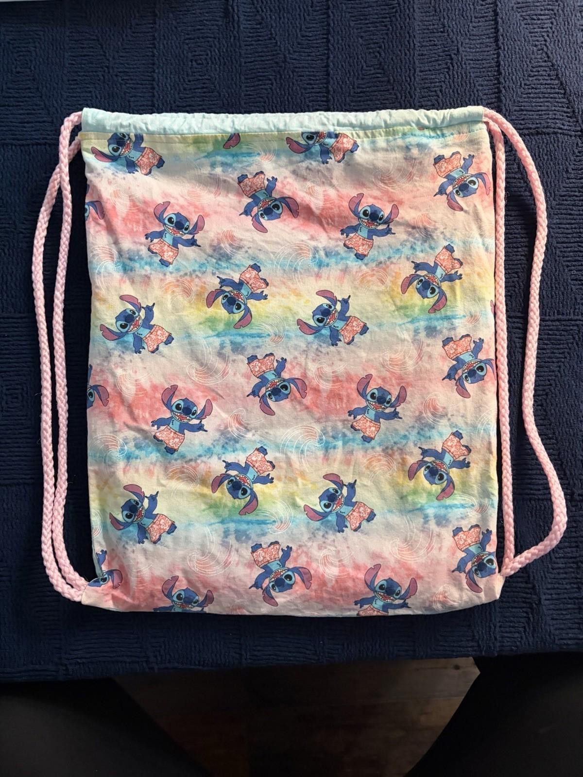 The Unbranded Brand Handmade Lilo &Stitch drawstring bag on tie-dye fabric. Size ONE SIZE - 1 Thumbnail