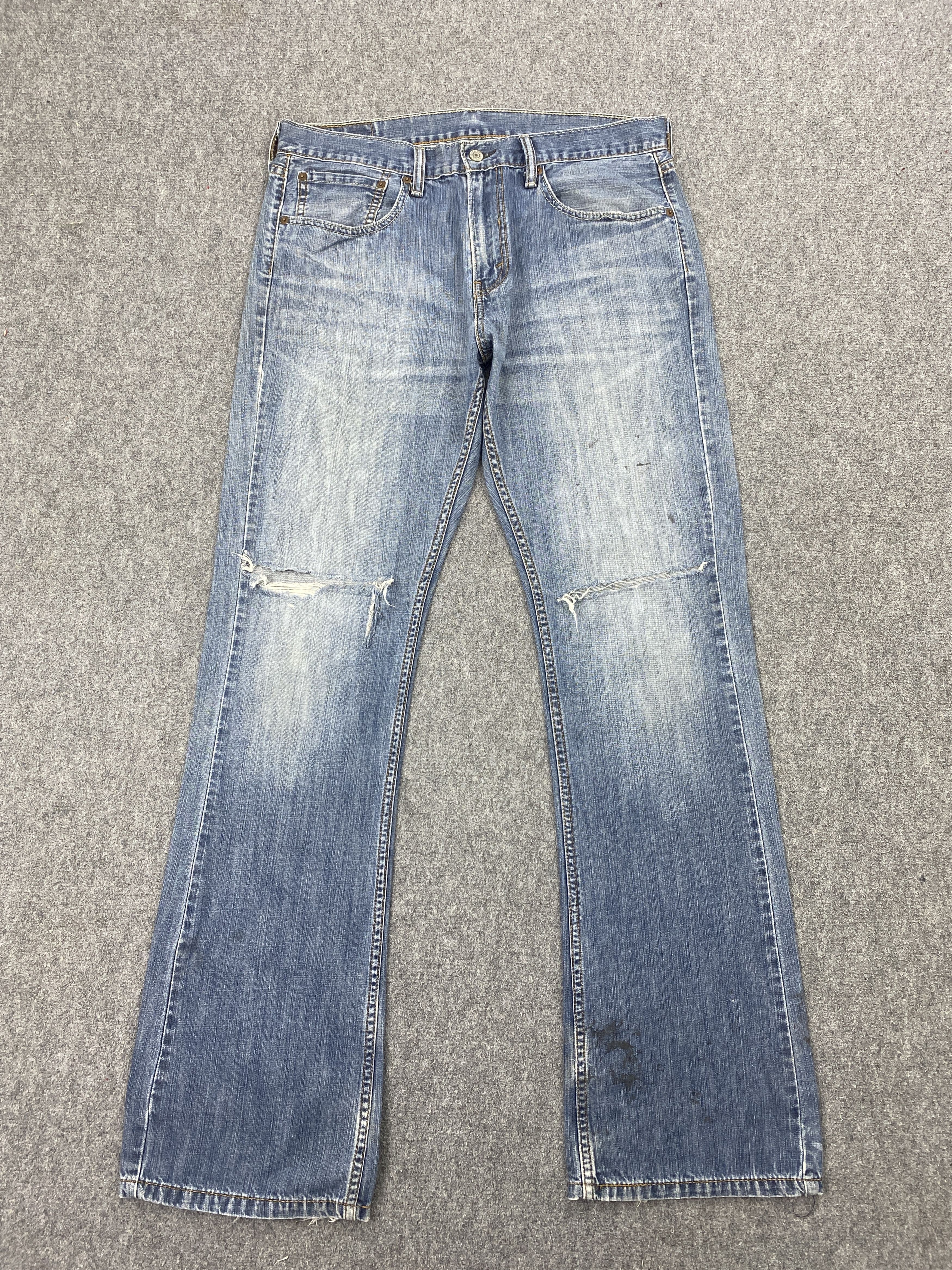 image of Levis x Vintage Distressed Vintage Levi's 527 Faded Blue Bootcut Jeans in Blue Denim (Size 35)