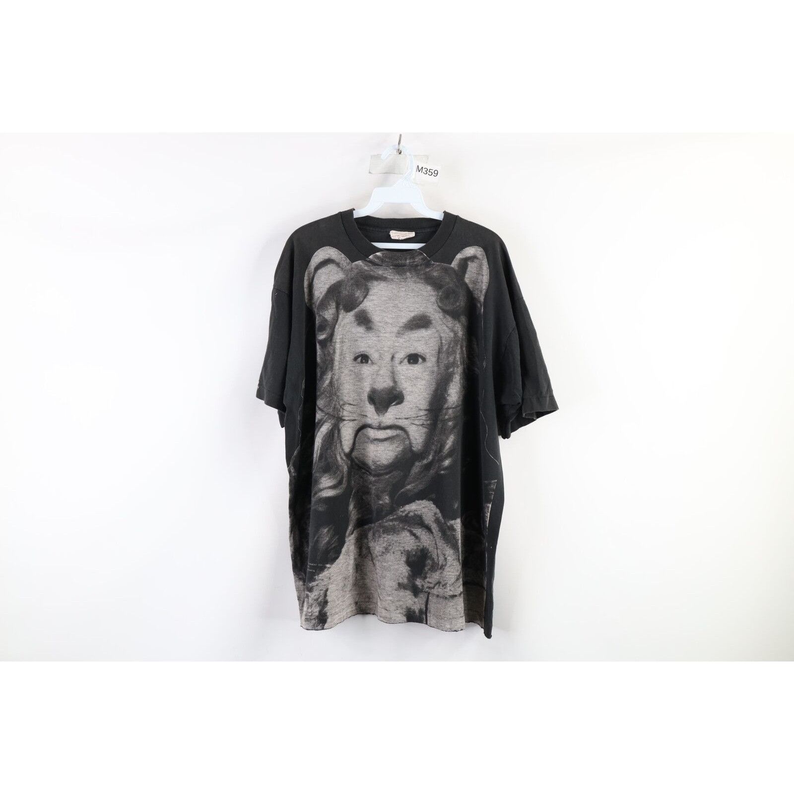 image of Vintage 90's All Over Print Wizard Of Oz Lion T-Shirt in Black, Men's (Size XL)