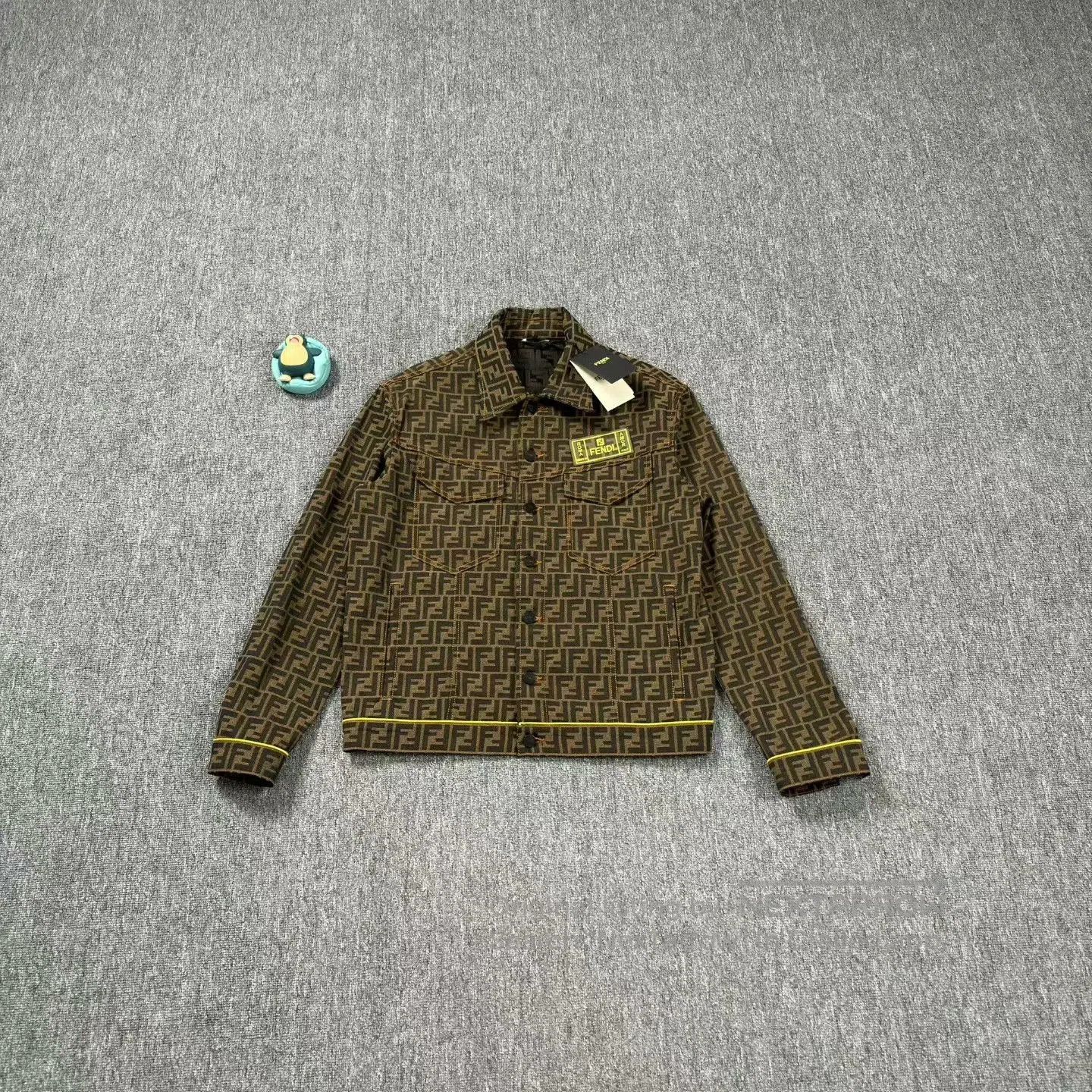 fendi monogram denim jacket with leather tag.