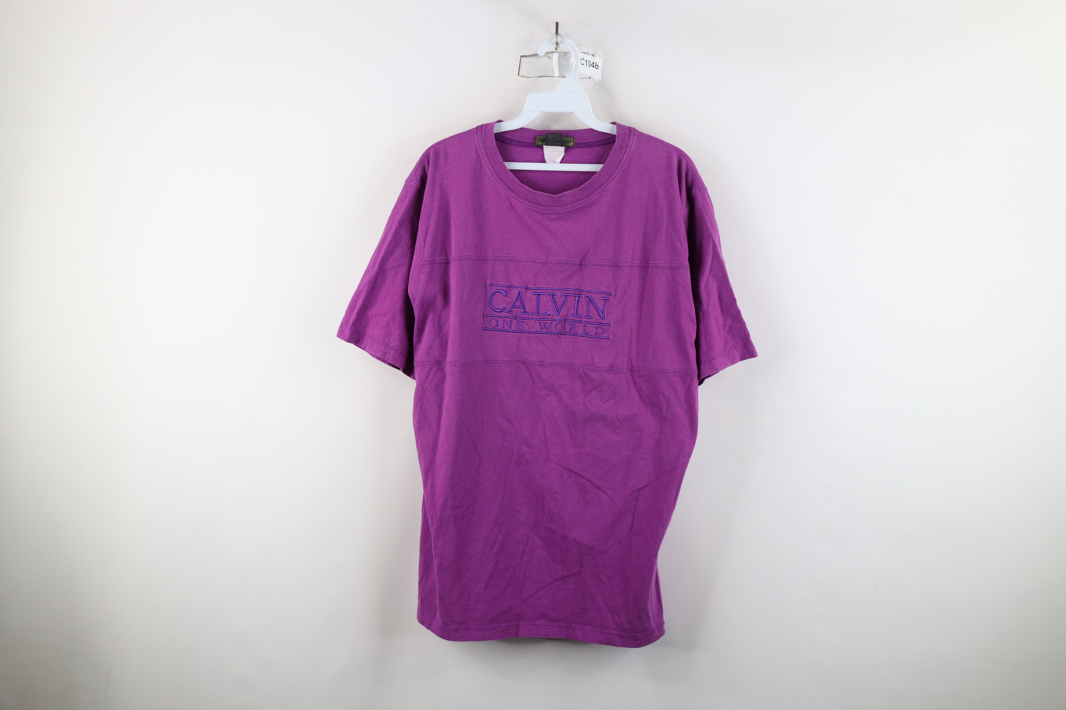 Calvin Klein × Vintage Vintage 90s Calvin Klein Spell Out One World T-Shirt Purple Size XXL / US 16-18 / IT 52-54 - 1 Thumbnail