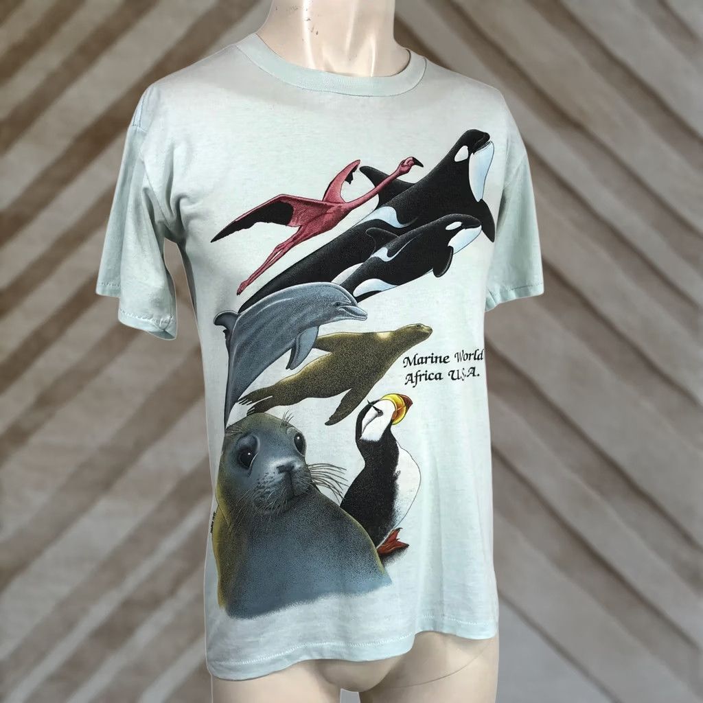 Vintage VINTAGE Marine World Africa U.S.A. T-Shirt Women M Light Blue Animal Graphic 80s Tee Size M / US 6-8 / IT 42-44 - 1 Thumbnail