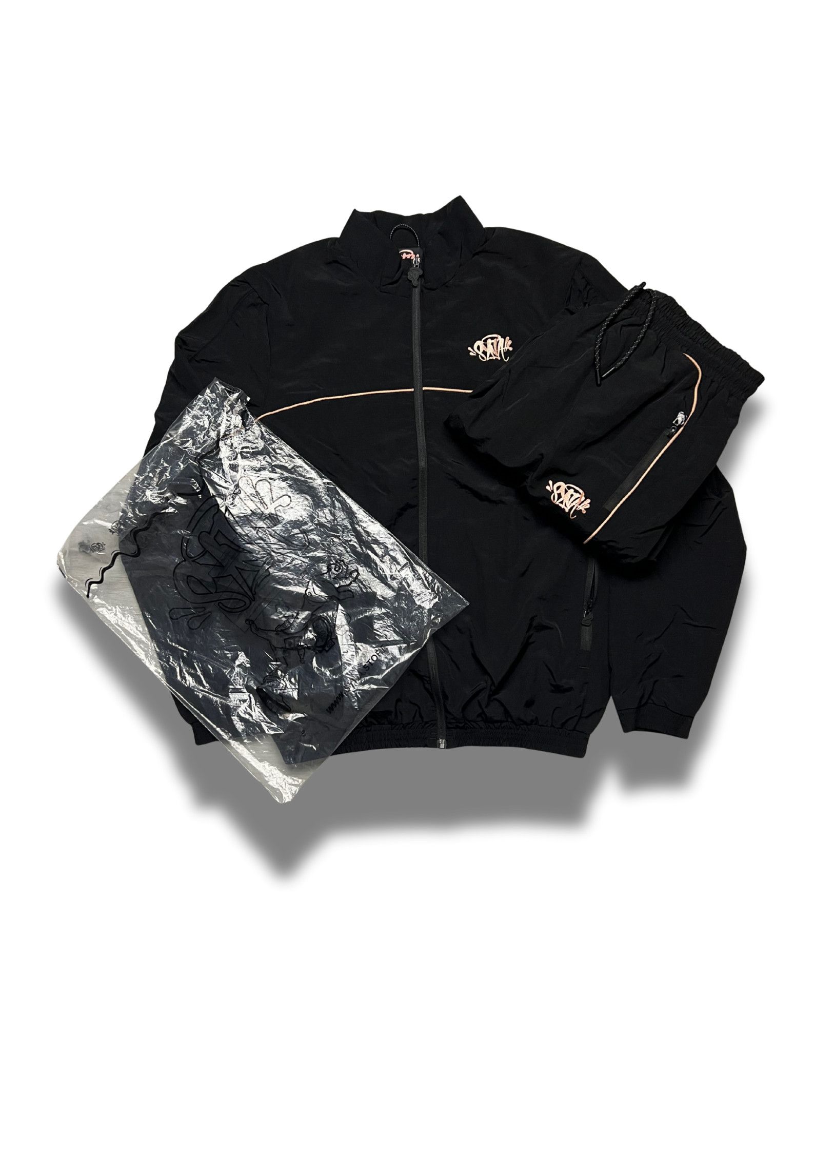 Syna World Shell Tracksuit “BLACK / GOLD” CHECK Description
