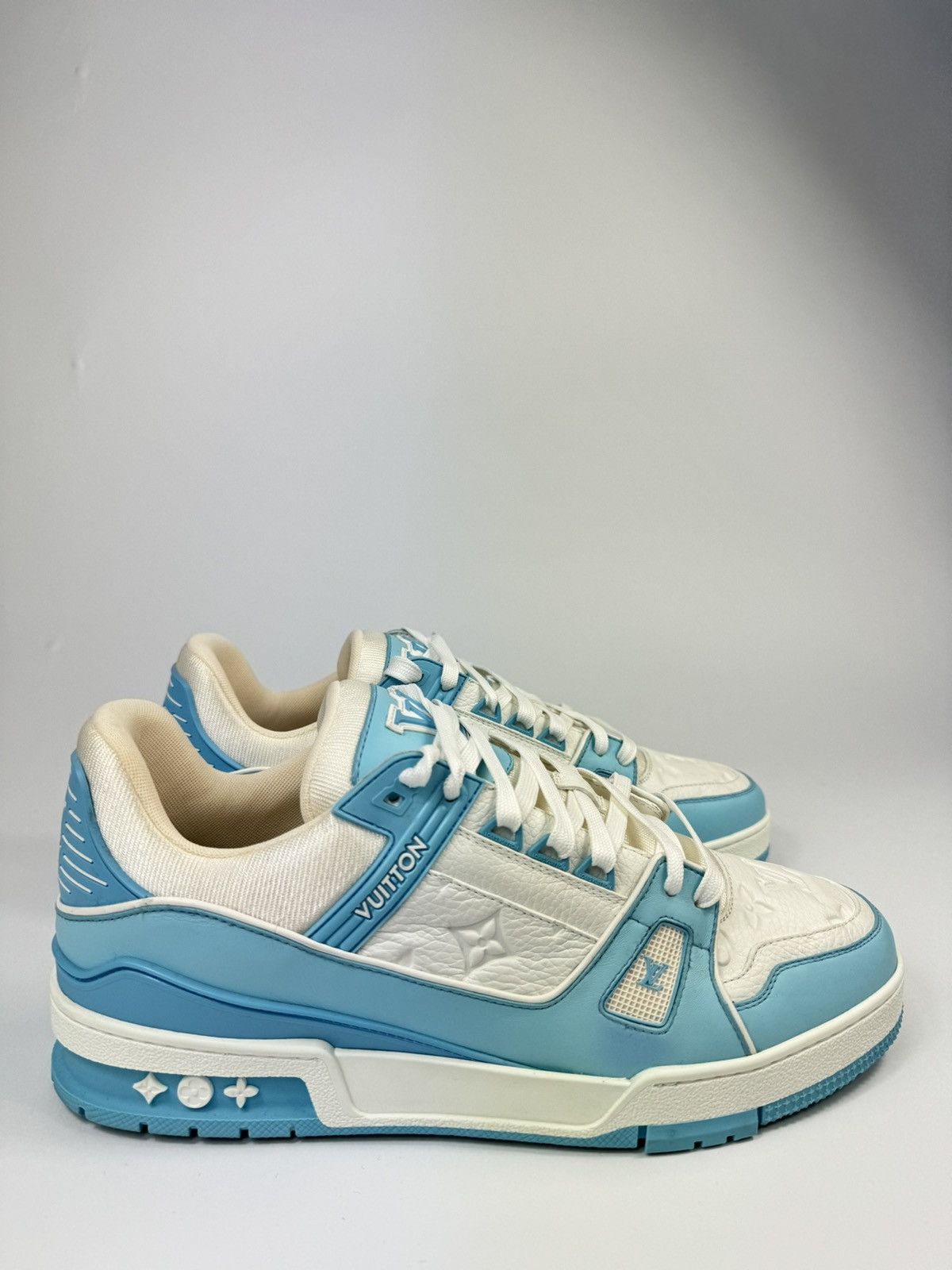 image of Louis Vuitton Monogram Embossed Sneakers in Blue, Men's (Size 10)