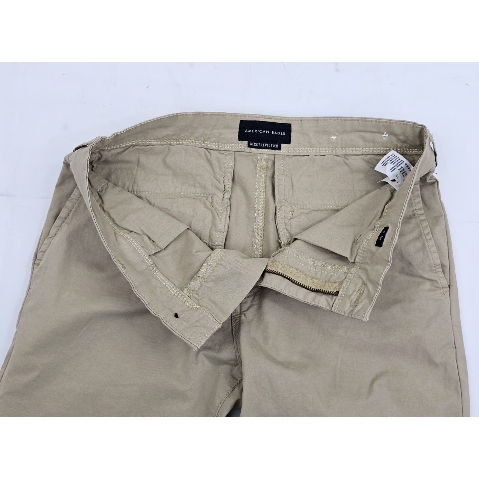 American Eagle Outfitters Nike Shirt Men Slim Chino Pants 30x34 Beige Tan EUC Slim Fit Flat Front Cotton Blend Spandex Logo 90s City College USA Mens Size US 30 / EU 46 - 6 Thumbnail