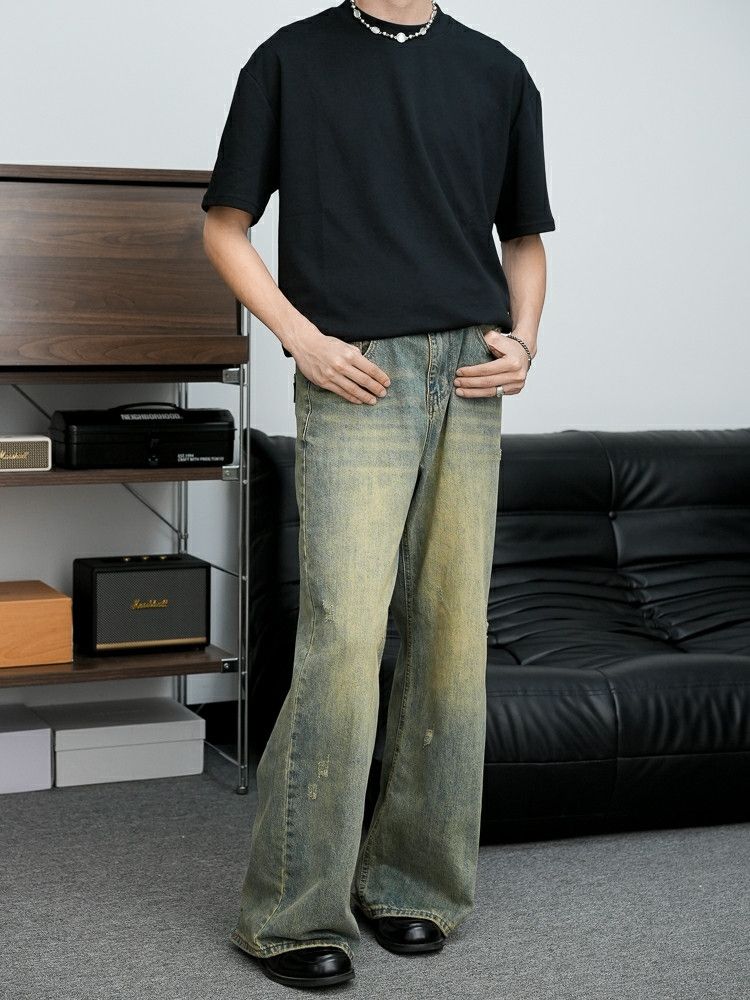 grunge washed faded flared damaged jeans