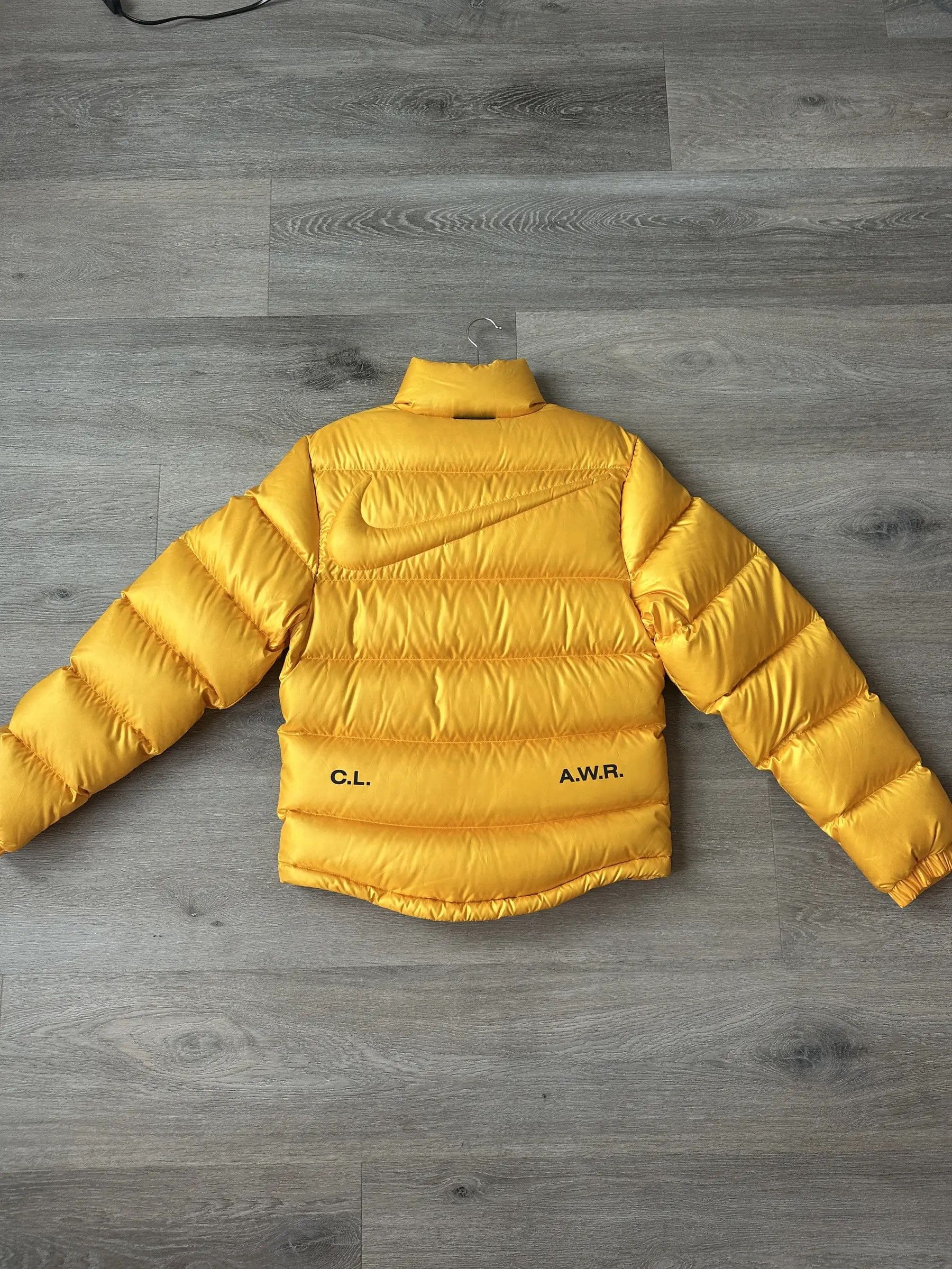 NOCTA Nike × NOCTA NRG AU Puffer Jacket 'University Gold' Size US XS / EU 42 / 0 - 1 Thumbnail