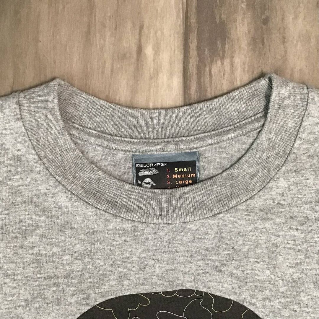 Bape × Kaws BAPE × KAWS NEON camo APE head T-shirt a bathing ape NIGO Size US S / EU 44-46 / 1 - 7 Thumbnail