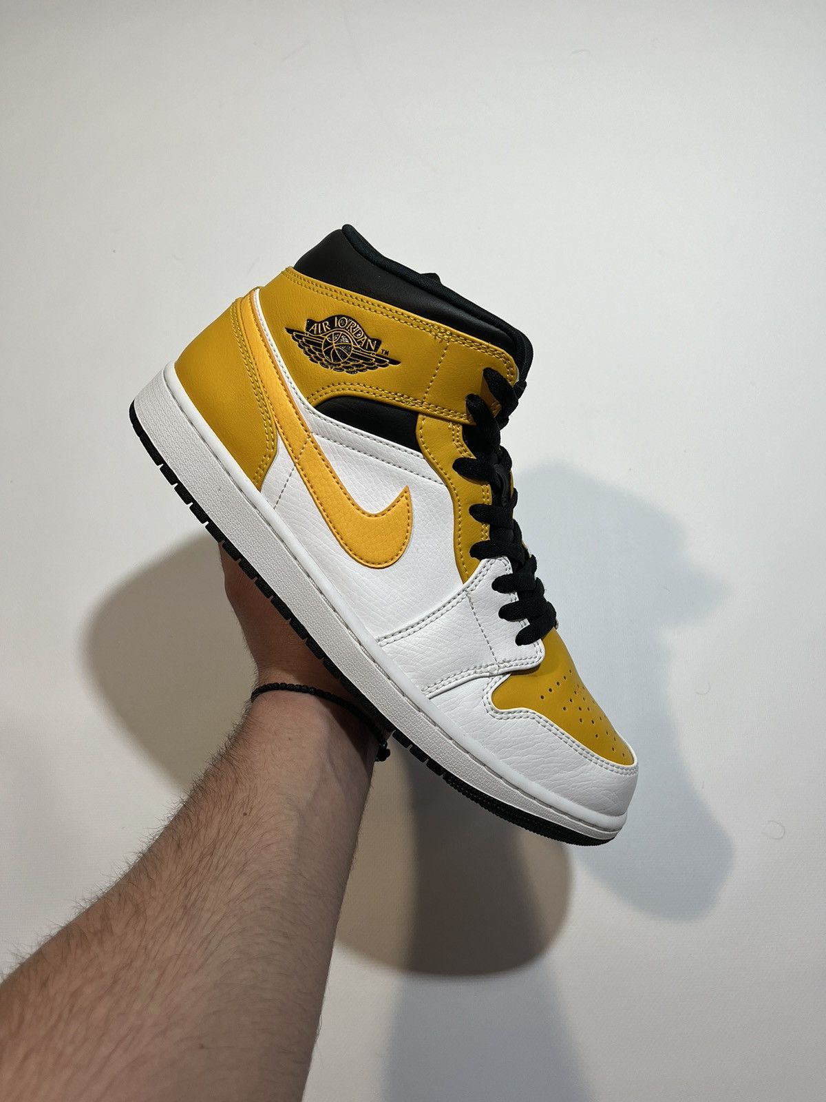 image of Jordan Nike Sneakers Jordan 1 Mid University Gold in Yellow, Men's (Size 11)