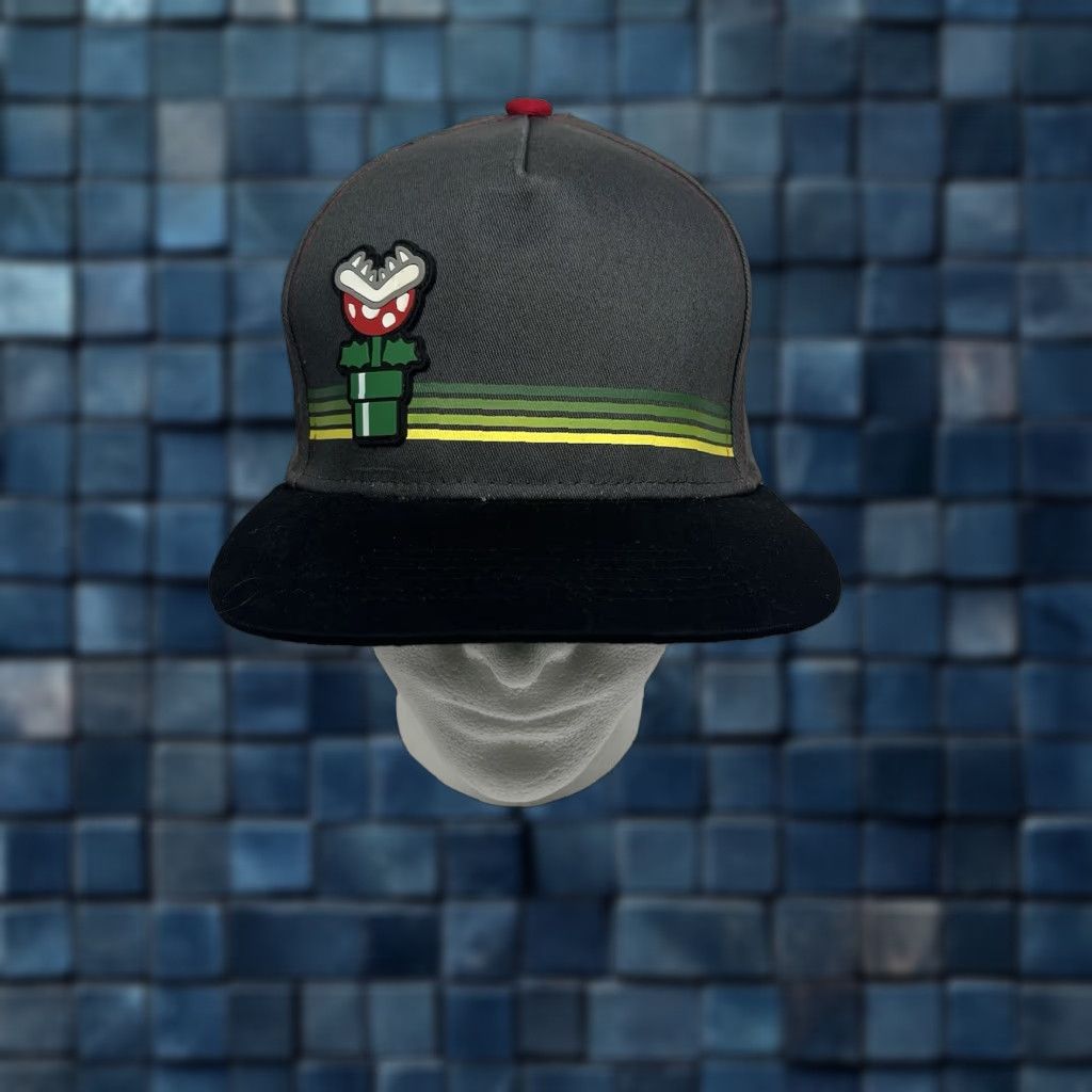 Nintendo VINTAGE Super Mario Bros SnapBack Hat Piranha Plant In Tunnel Official Nintendo 2018 Bonafide Mario Snapback Men One Size Black Cotton Adjustable Hat Size ONE SIZE - 1 Thumbnail