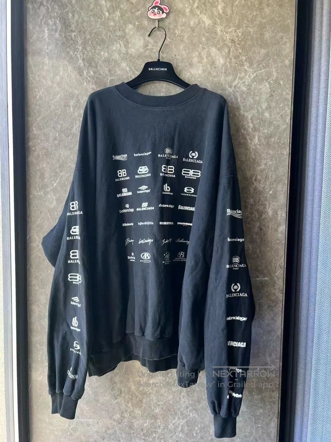 Balenciaga All-Over Logo Sweatshirt.
