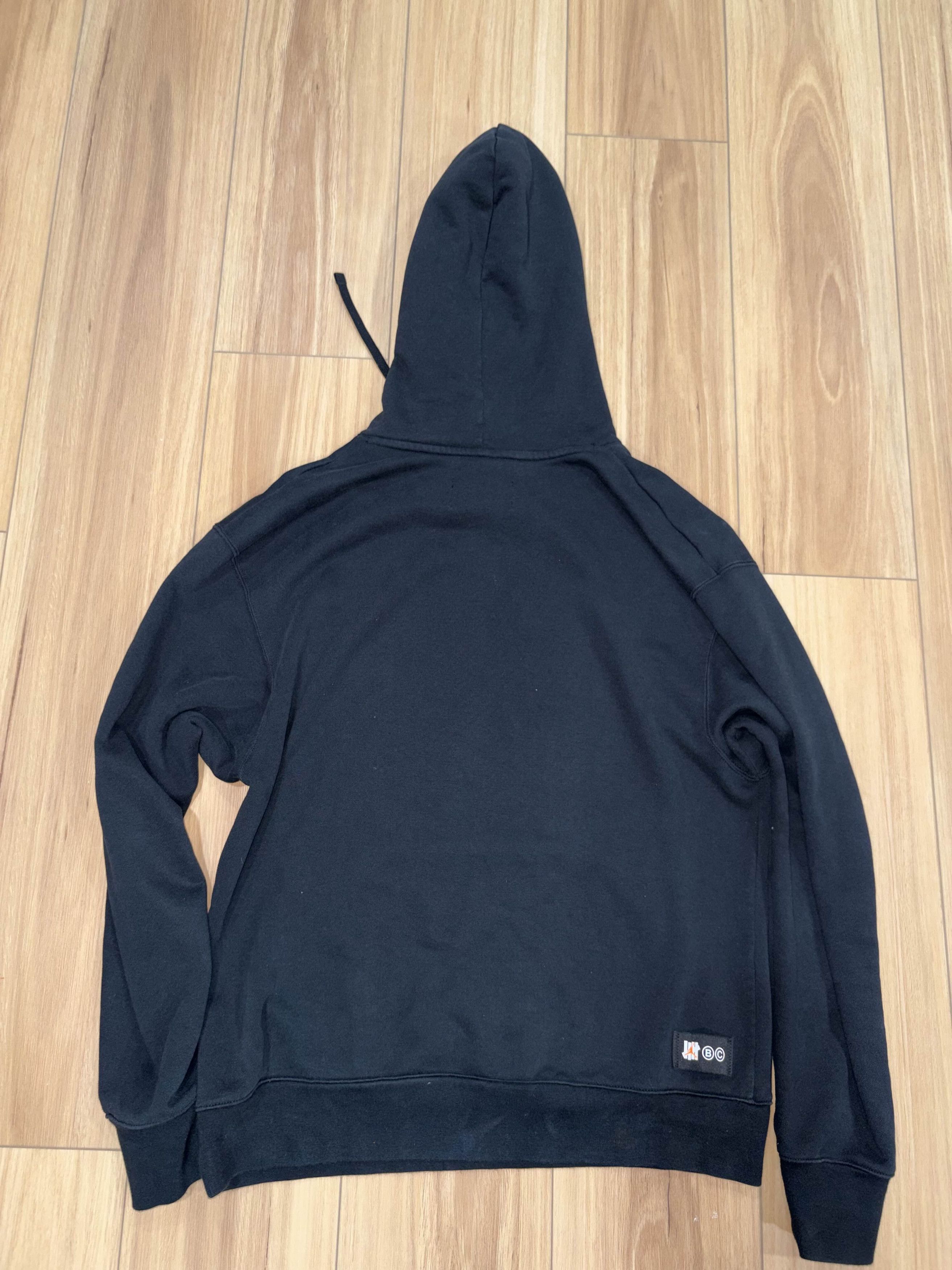 Jordan Brand × Undefeated Air Jordan x Undefeated Hoodie 'Black' DX4299 010 Size US M / EU 48-50 / 2 - 5 Thumbnail