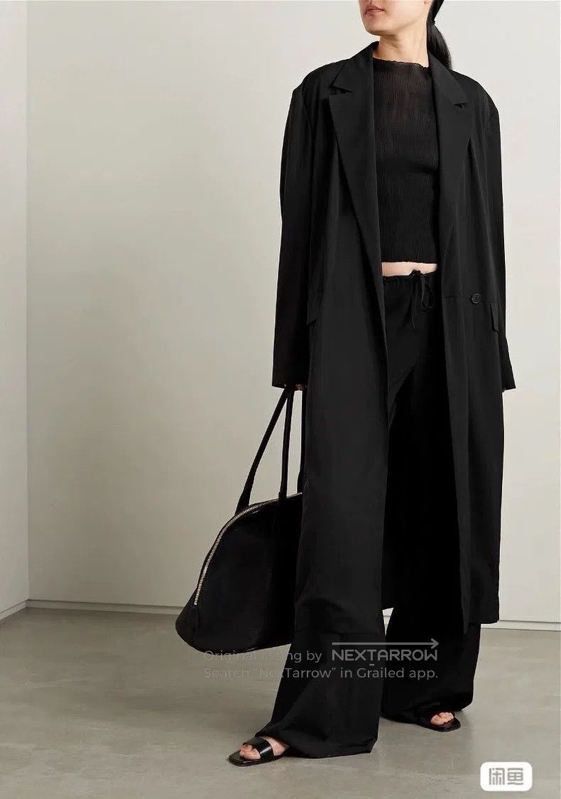 The row Black windbreaker coat