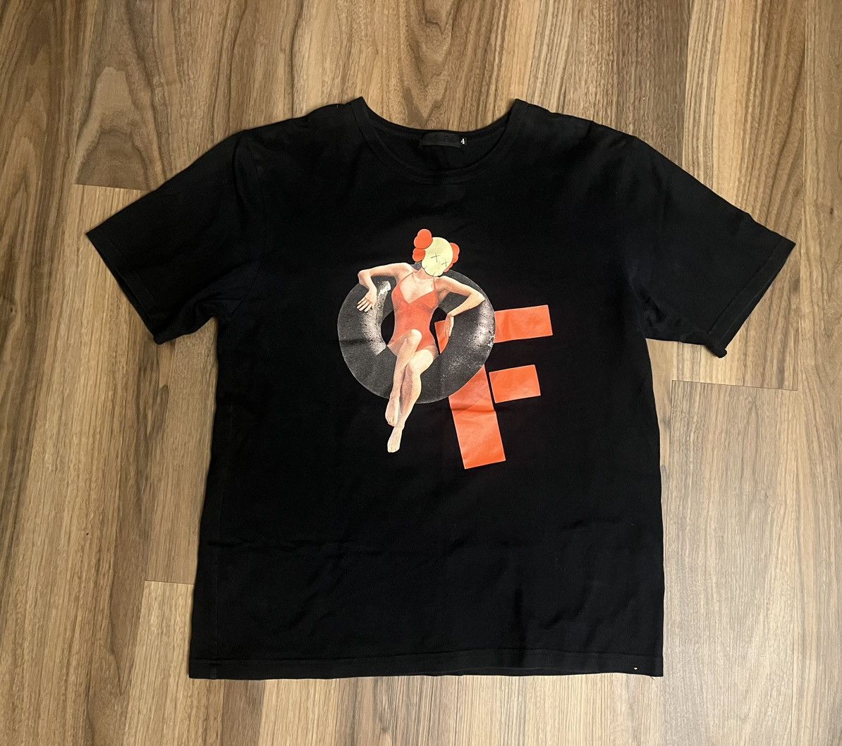 image of Kaws Original Fake Pool Floaty T-Shirt in Black, Men's (Size XL)