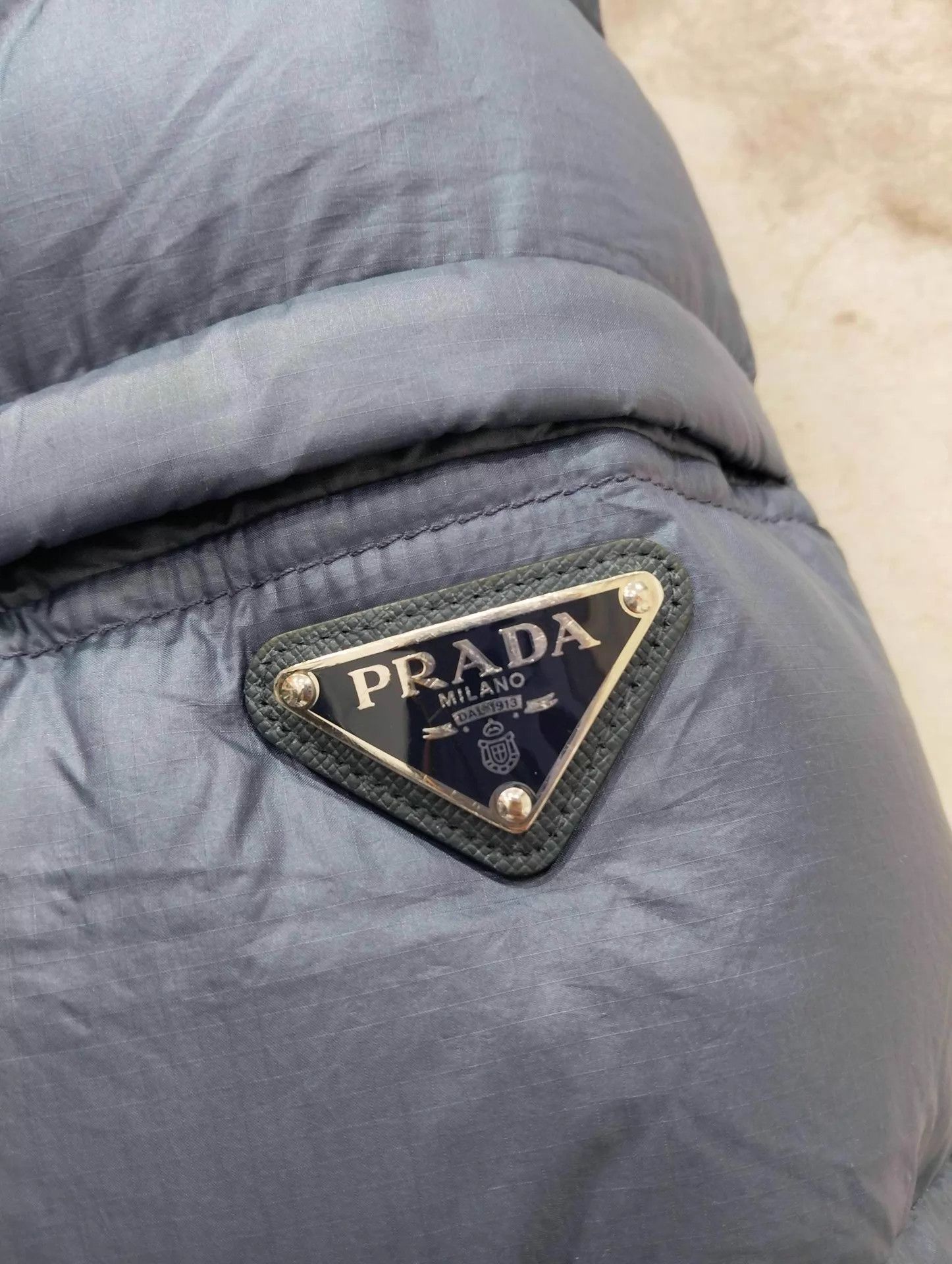 Prada Prada solid triangle logo stand collar puffer size 48 Size US M / EU 48-50 / 2 - 7 Thumbnail