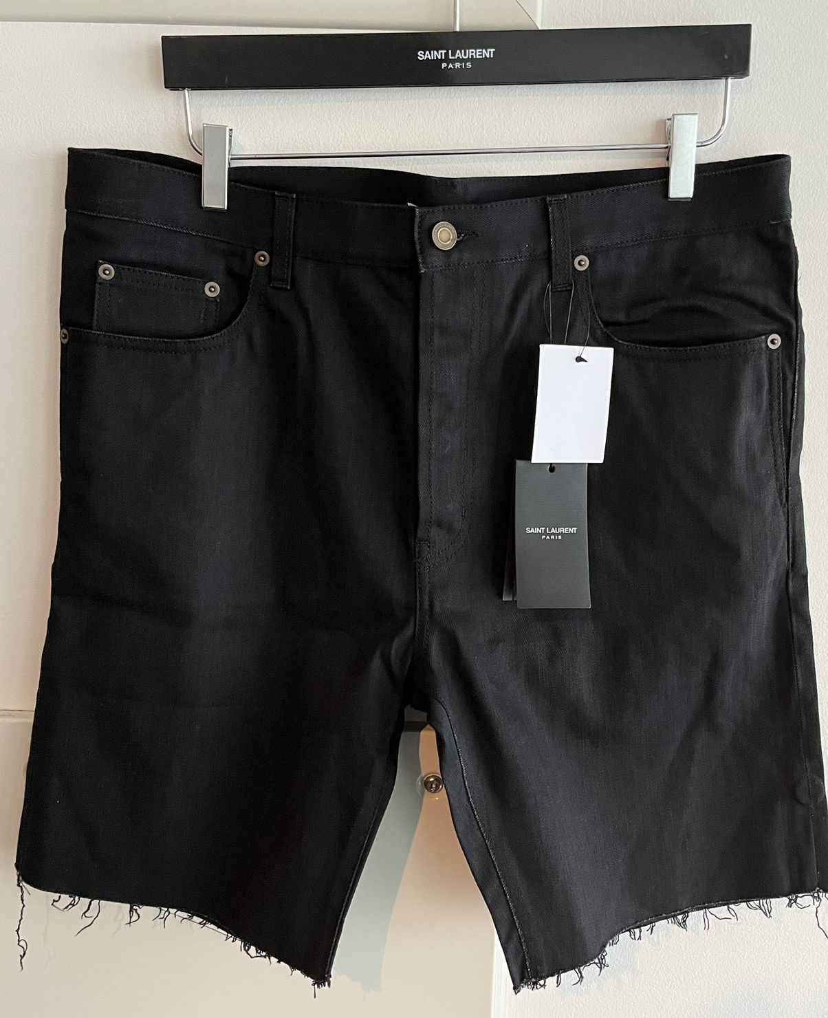 image of Hedi Slimane x Saint Laurent Paris Super Runway Saint Laurent Distressed Denim Shorts in Black (Siz