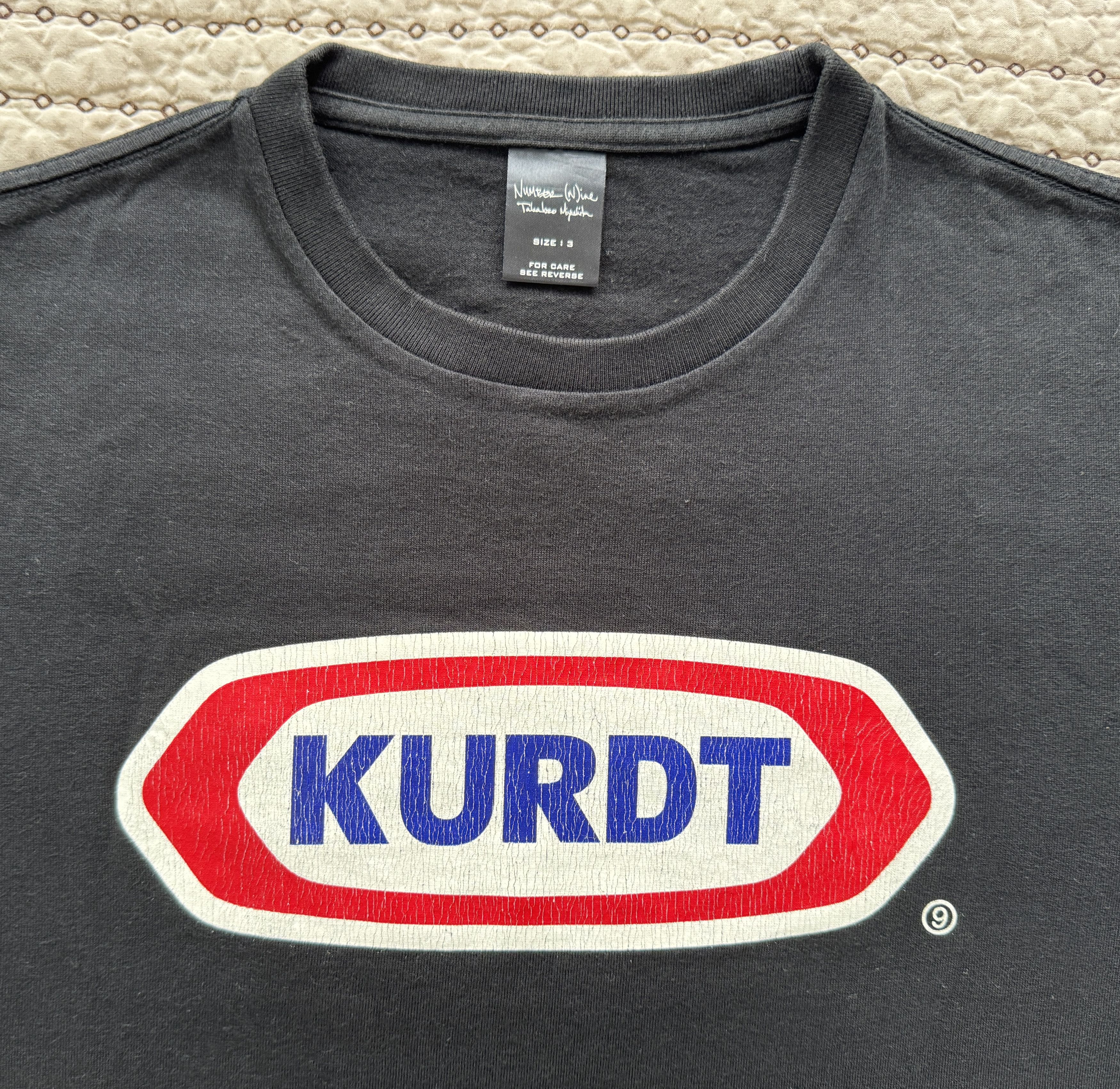 Number (N)ine NUMBER (N)INE - 'KURDT' T-SHIRT BLACK SIZE 3 KRAFT HOMAGE Size US L / EU 52-54 / 3 - 9 Thumbnail