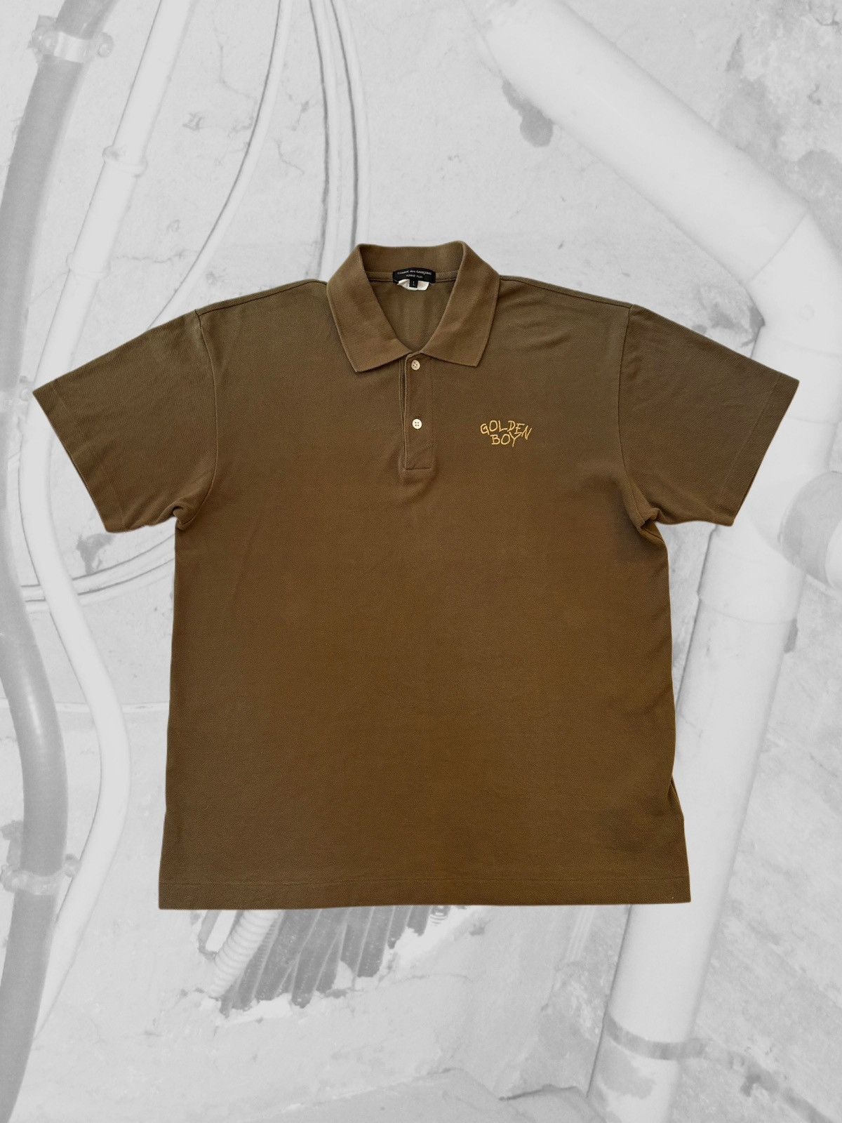 CDG Homme Plus “Golden Boy” Polo shirt