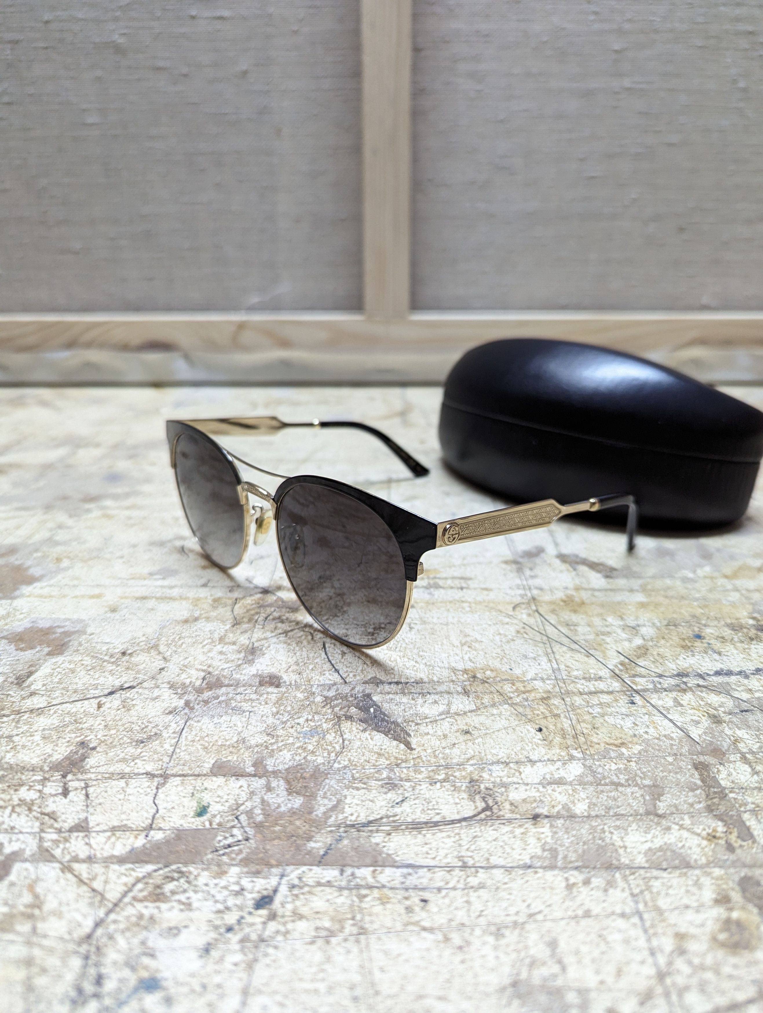 image of 00S Gucci Gold & Black Oval Sunglasses, Women's