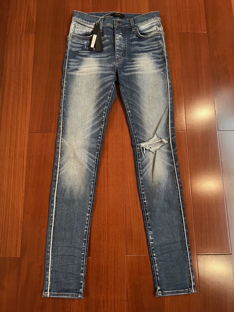 Amiri side diamond single tear blue jeans