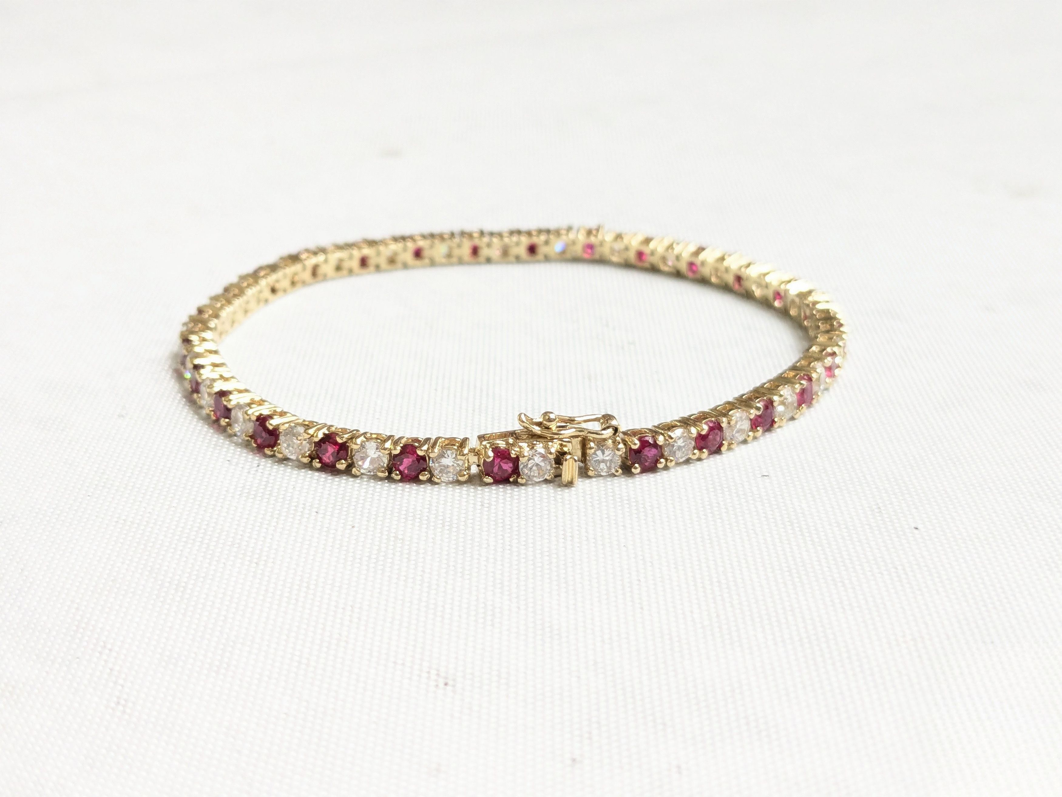 Jewelry Sterling Silver Tennis Bracelet Ruby CZ 7" Gold Plated Size ONE SIZE - 1 Thumbnail