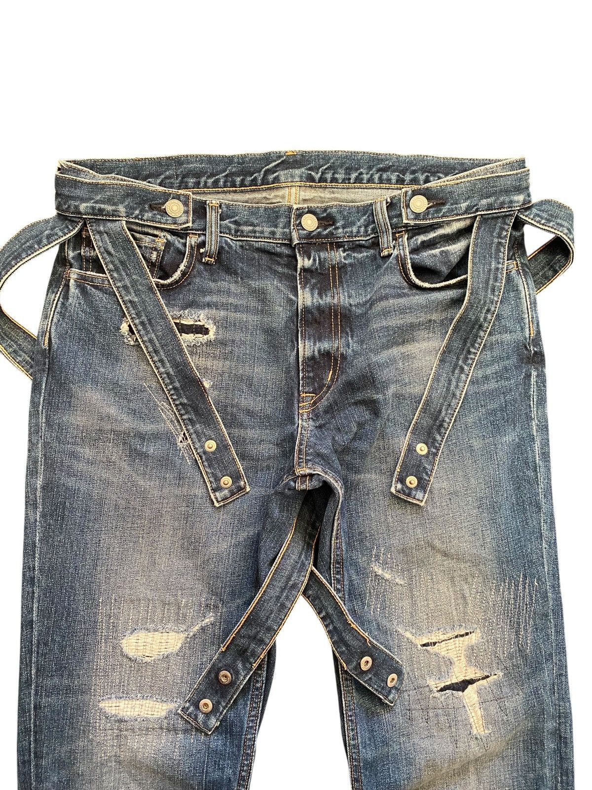 Kim Jones x GU distressed bondage denim