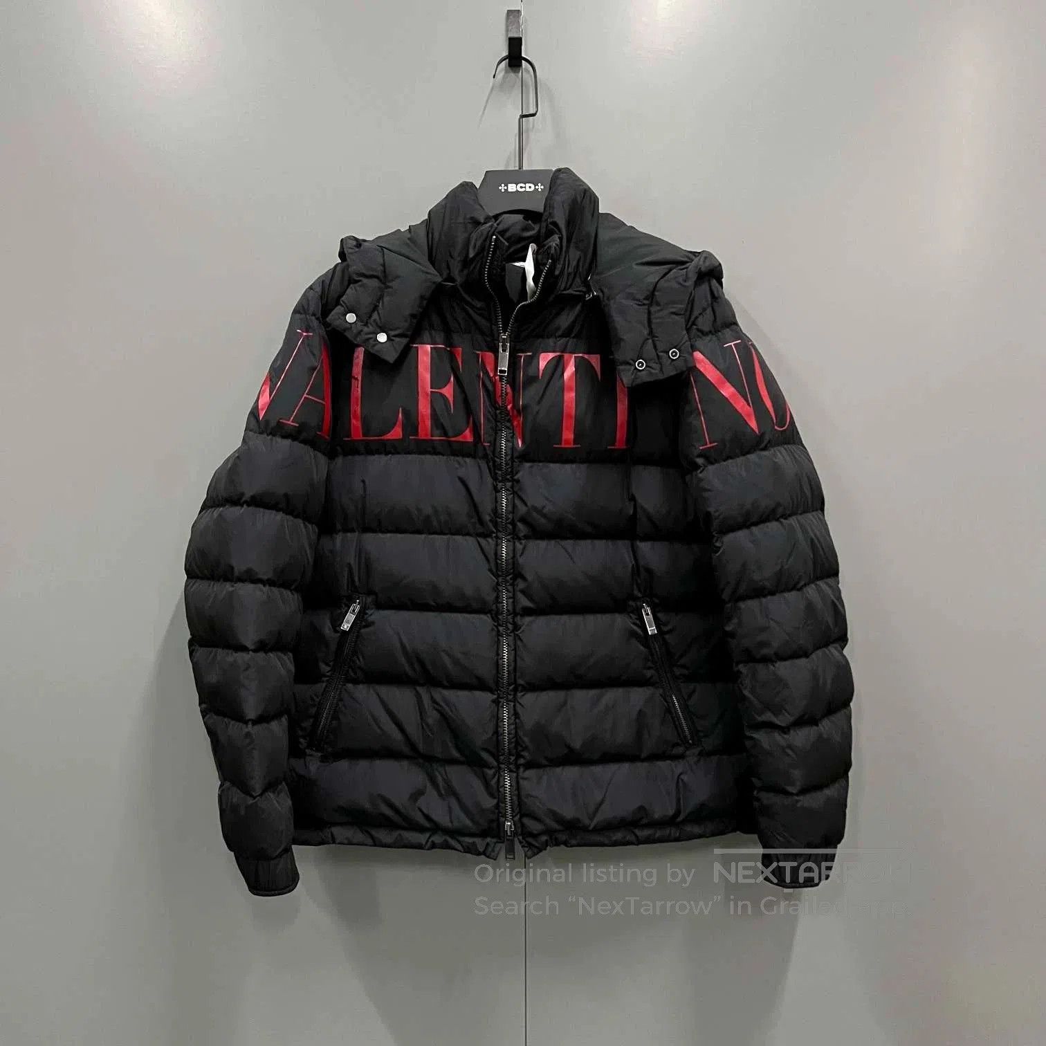 black and red logo puffer jacket by valentino.