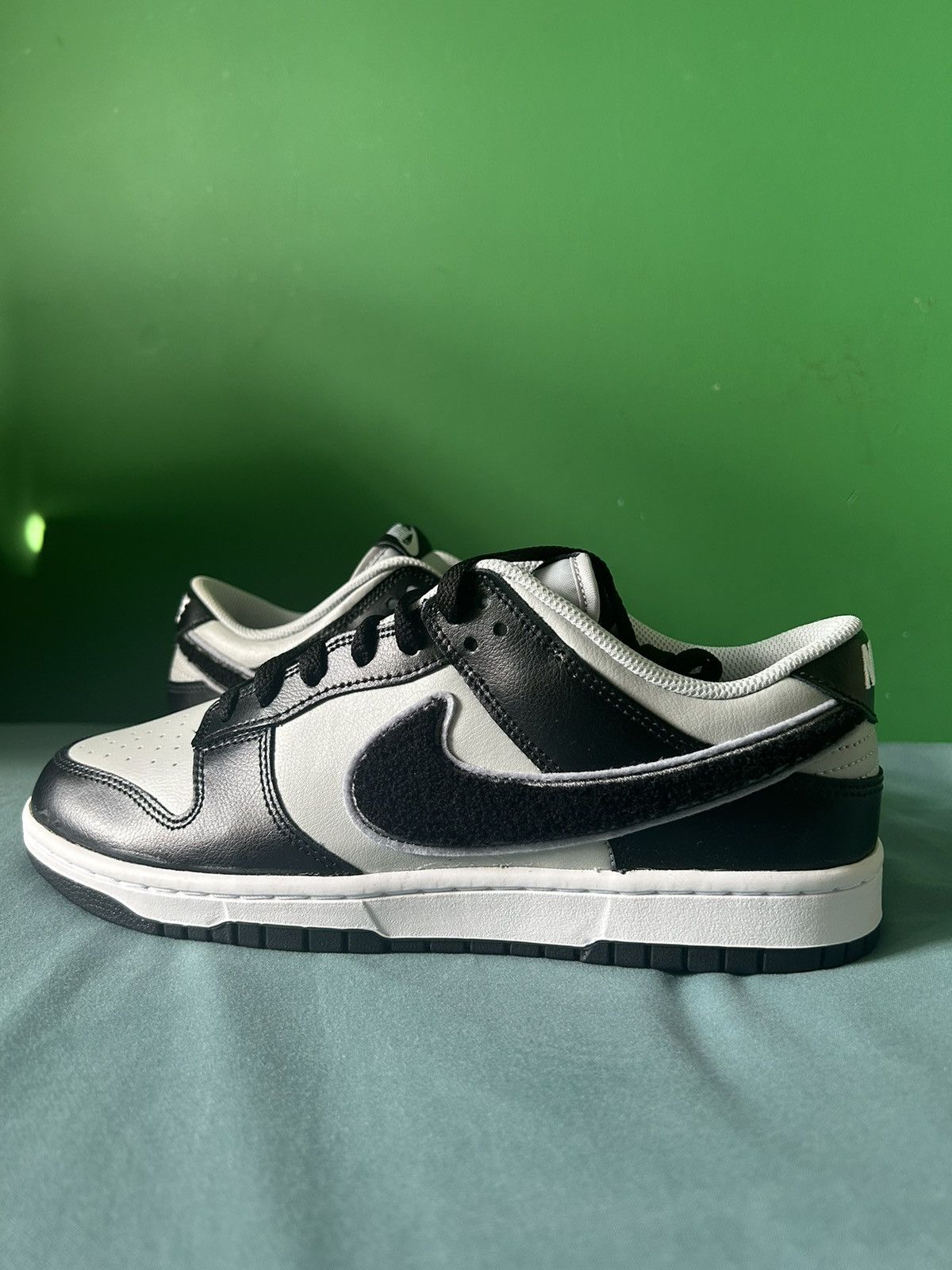 image of Nike Dunk Low Chenille Swoosh 2022 Shoes in Black, Men's (Size 10)