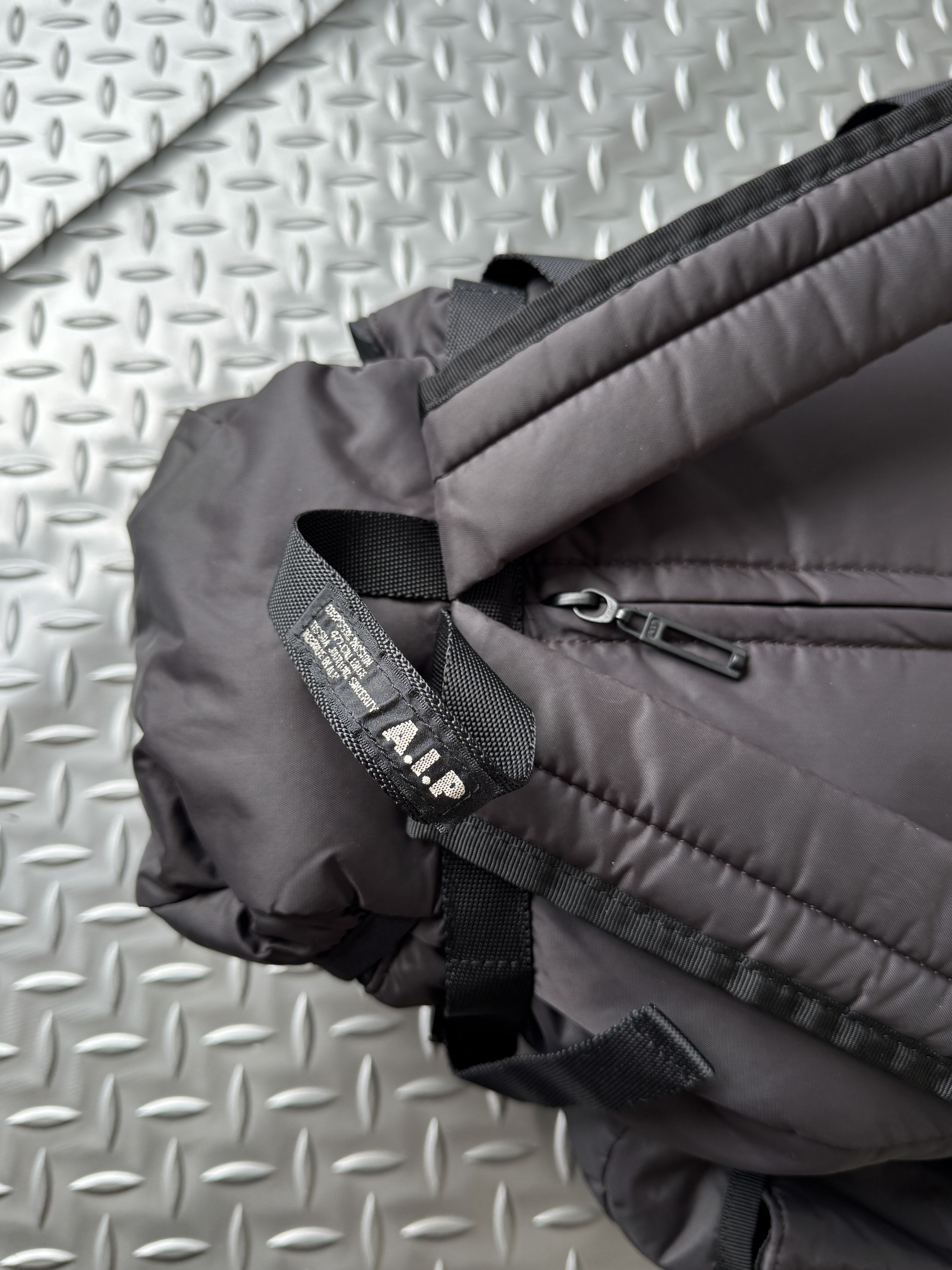 A.I.P Multi-Pocket Puffer Backpack