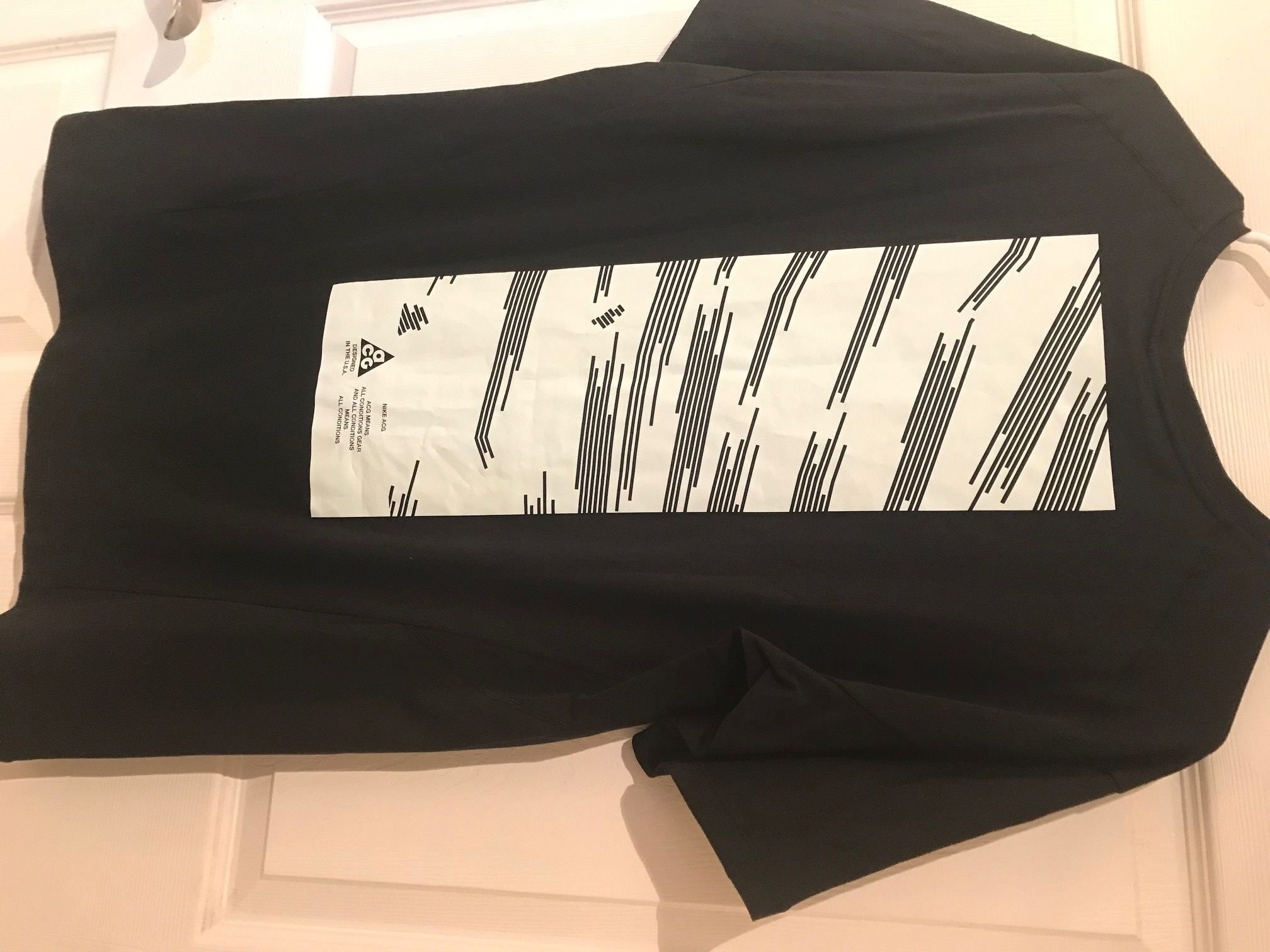 image of Nike Acg Barely Green Logo Tee in Black, Men's (Size Medium)