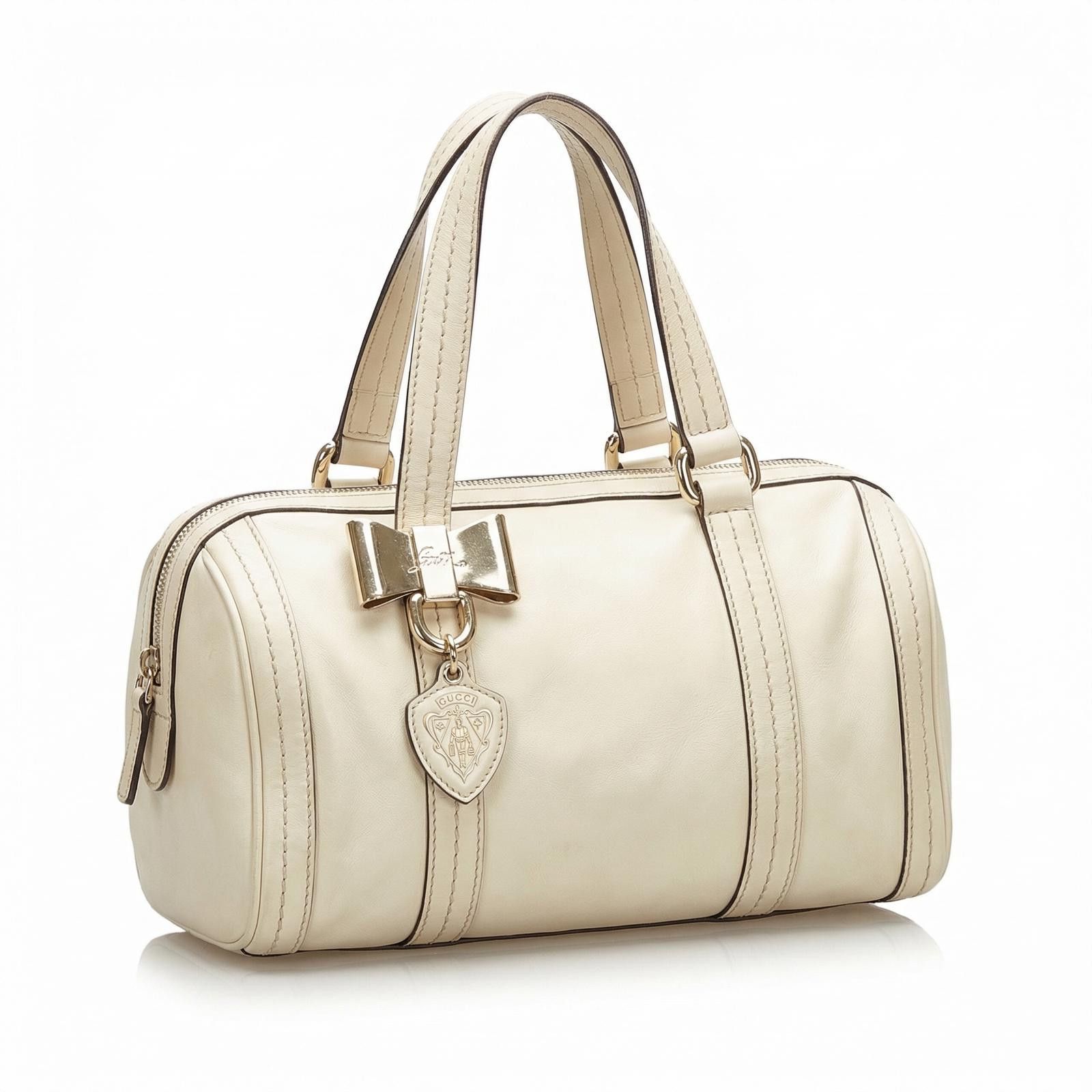 Gucci Gucci - Cream Leather Handbag Gold Bow Charm Size ONE SIZE - 1 Thumbnail