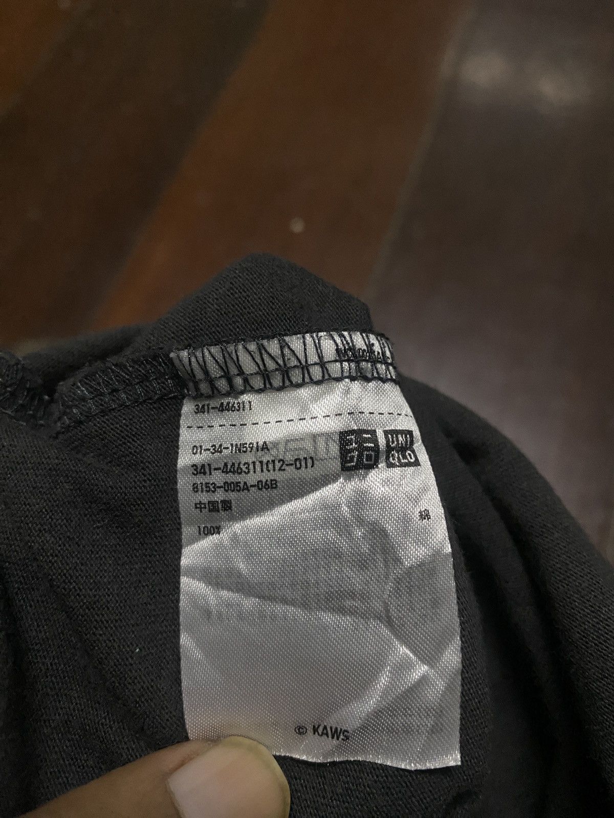Hypebeast × Kaws FIRE 🔥🔥 UNIQLO X KAWS TOKYO FIRST SAD DESIGN Size US L / EU 52-54 / 3 - 12 Thumbnail