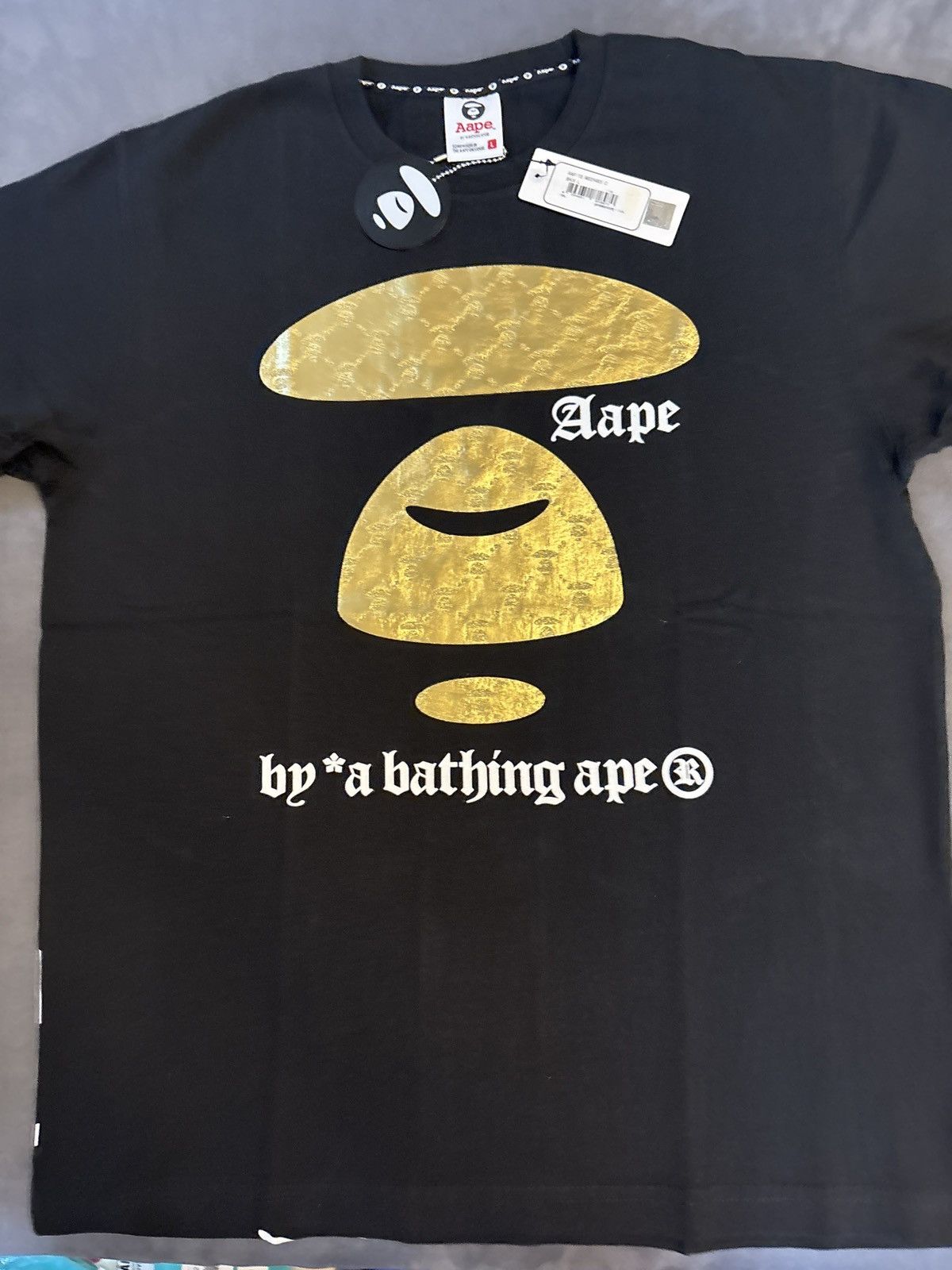 Aape by a bathing ape black and gold tee