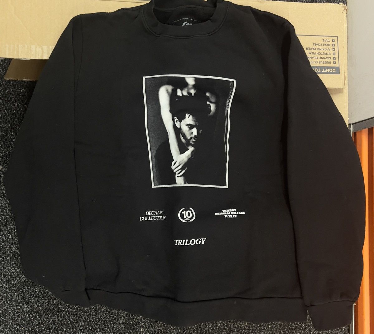 The Weeknd THE WEEKND-TRILOGY DECADE COVER CREWNECK SWEATSHIRT - BLACK ...