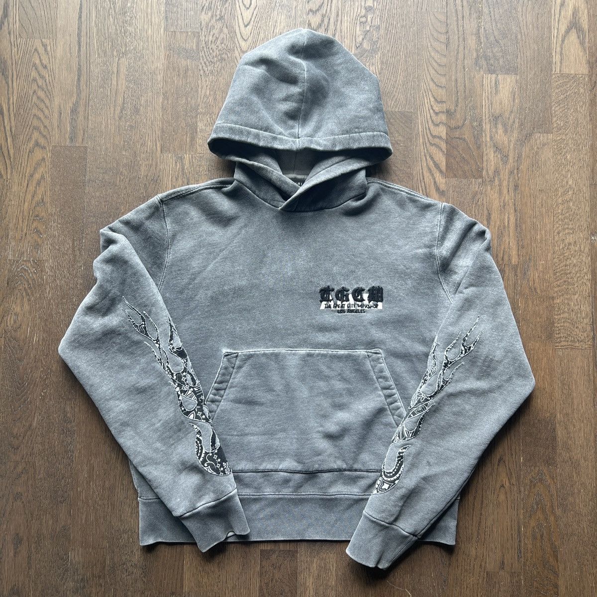 存在感絶大【AMIRI】T.G.C.W Flames パーカー T.G.C.W. Flames Hoodie Grey and Black | The Webster