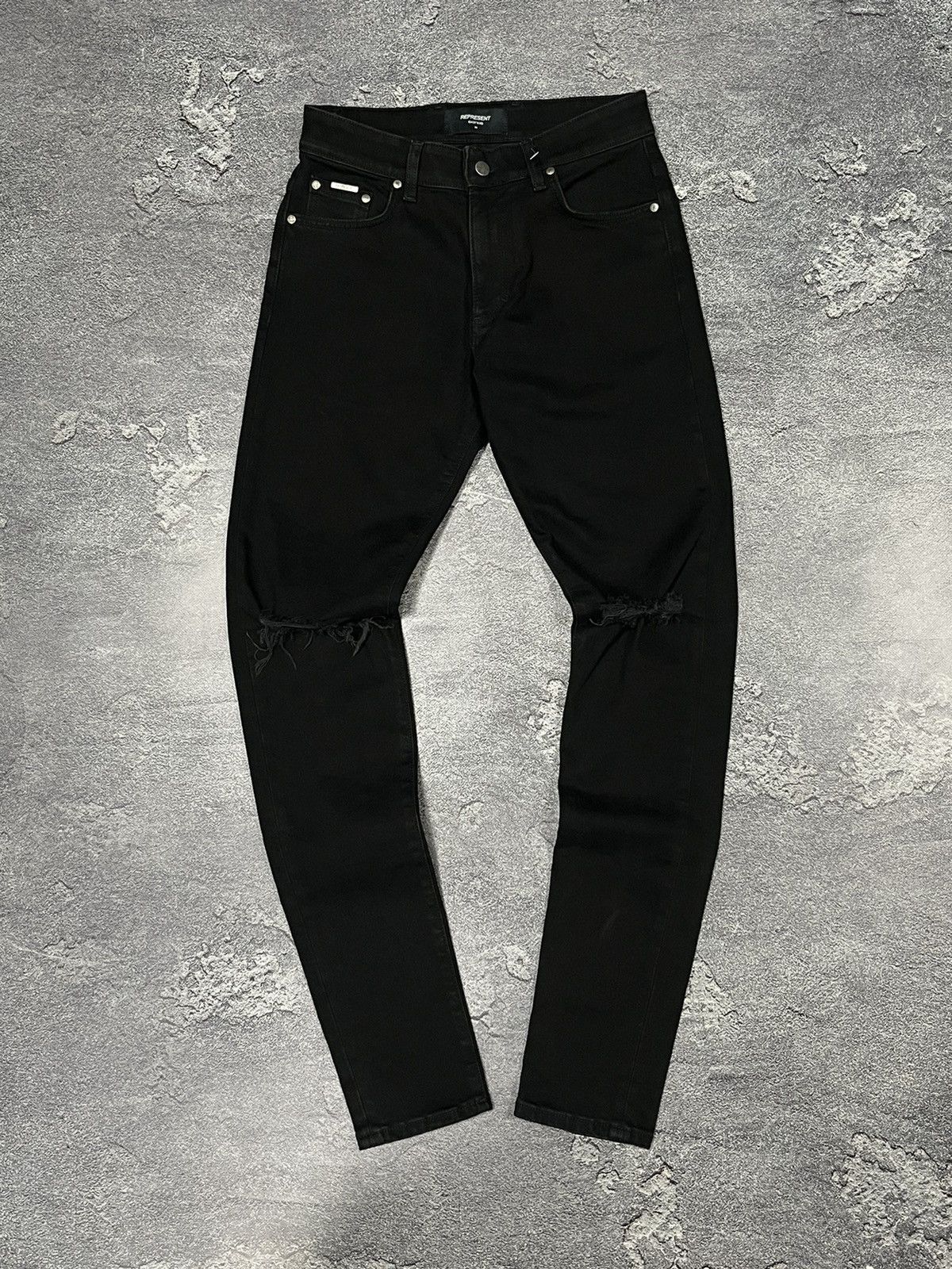 Represents skinny destroyer denim jeans