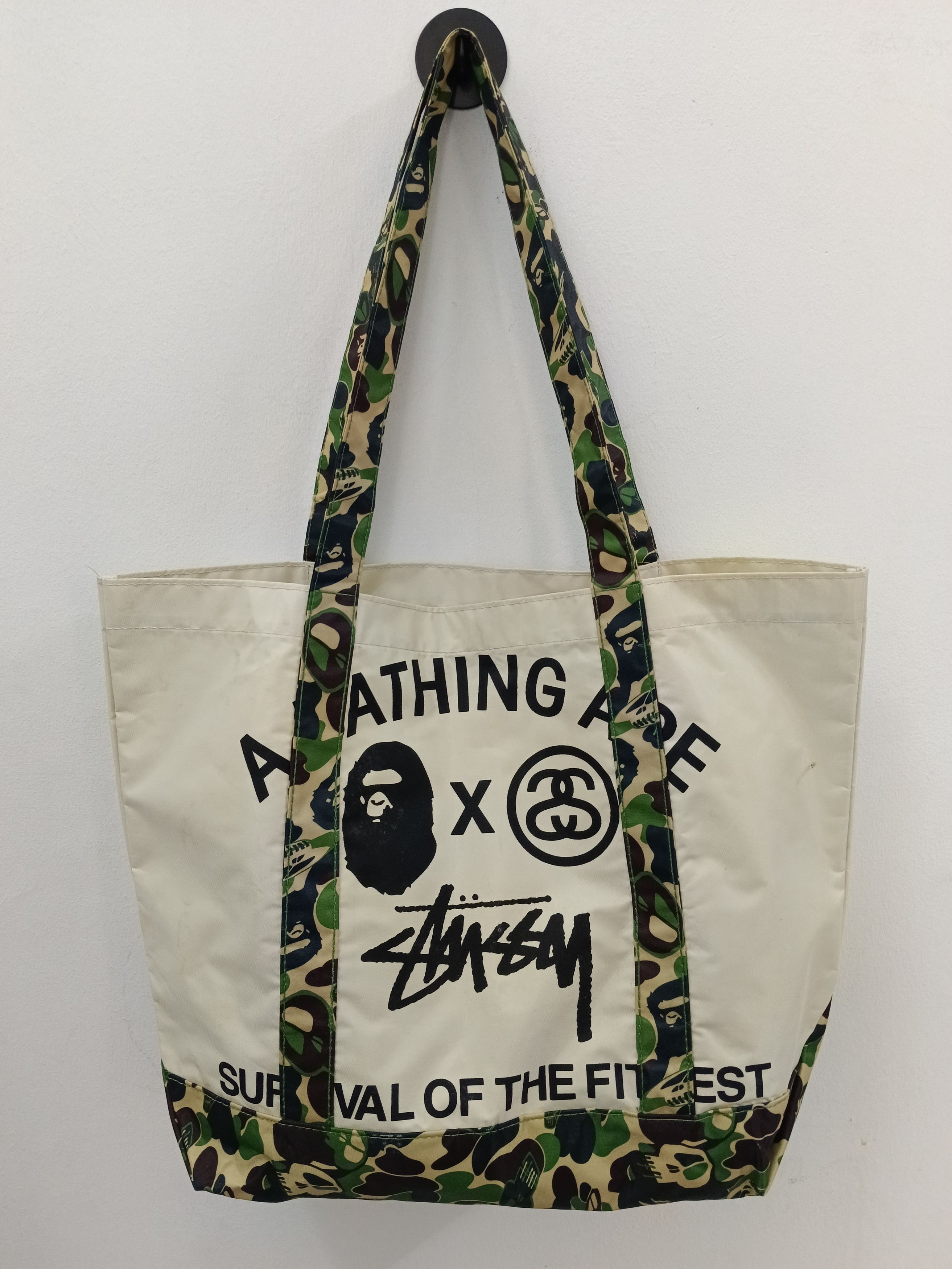 Bape × Stussy BAPE x Stussy "Survival of the Fittest" Camo Strap Tote Bag Size ONE SIZE - 1 Thumbnail