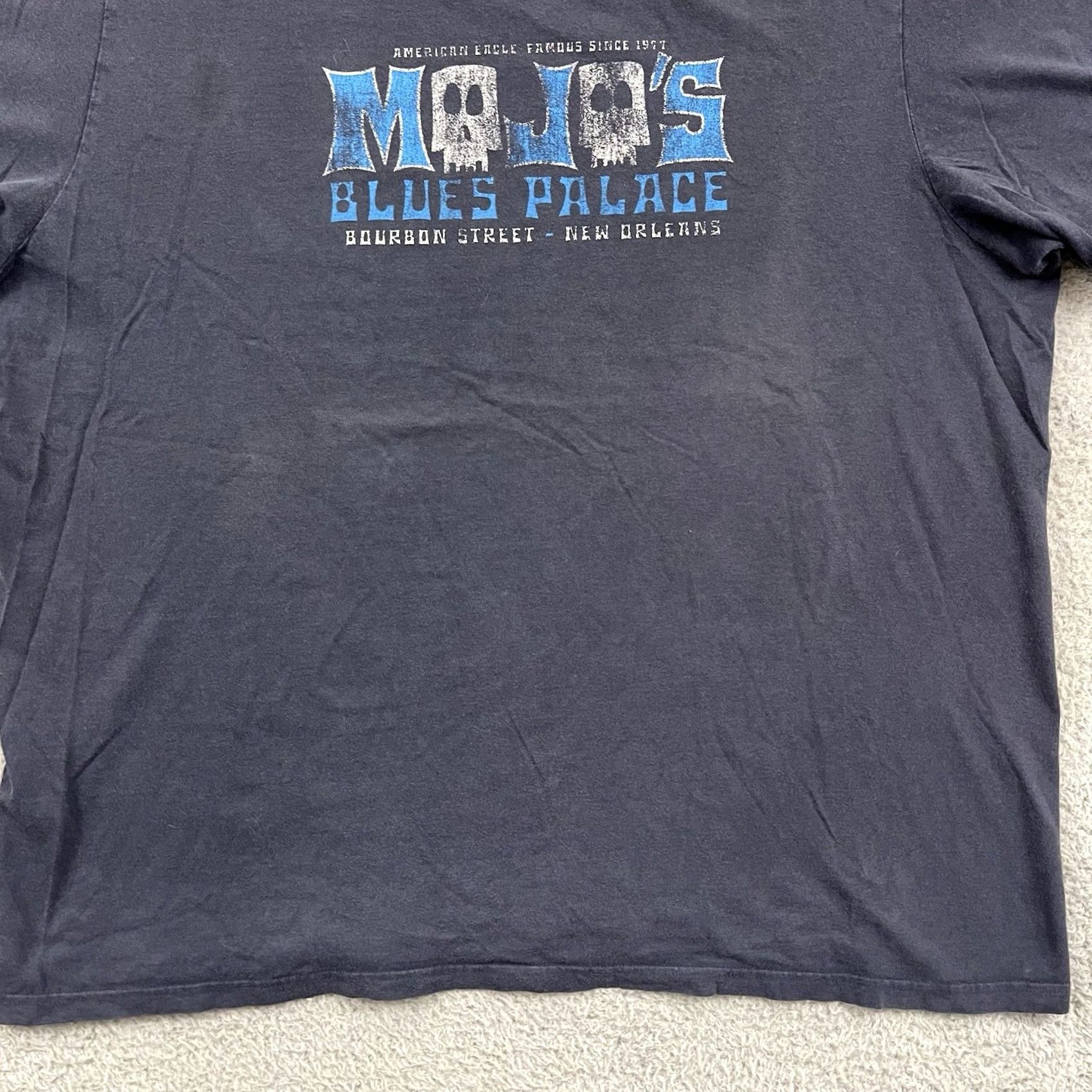 American Eagle Outfitters VINTAGE Mojos Blues Palace T-Shirt Adult 2XL Blue Graphic Tee Shirt Regular Mens Blue 2000s USA Graphic Print Cotton Skull Adventure Time Angel Bike Size US XXL / EU 58 / 5 - 2 Thumbnail