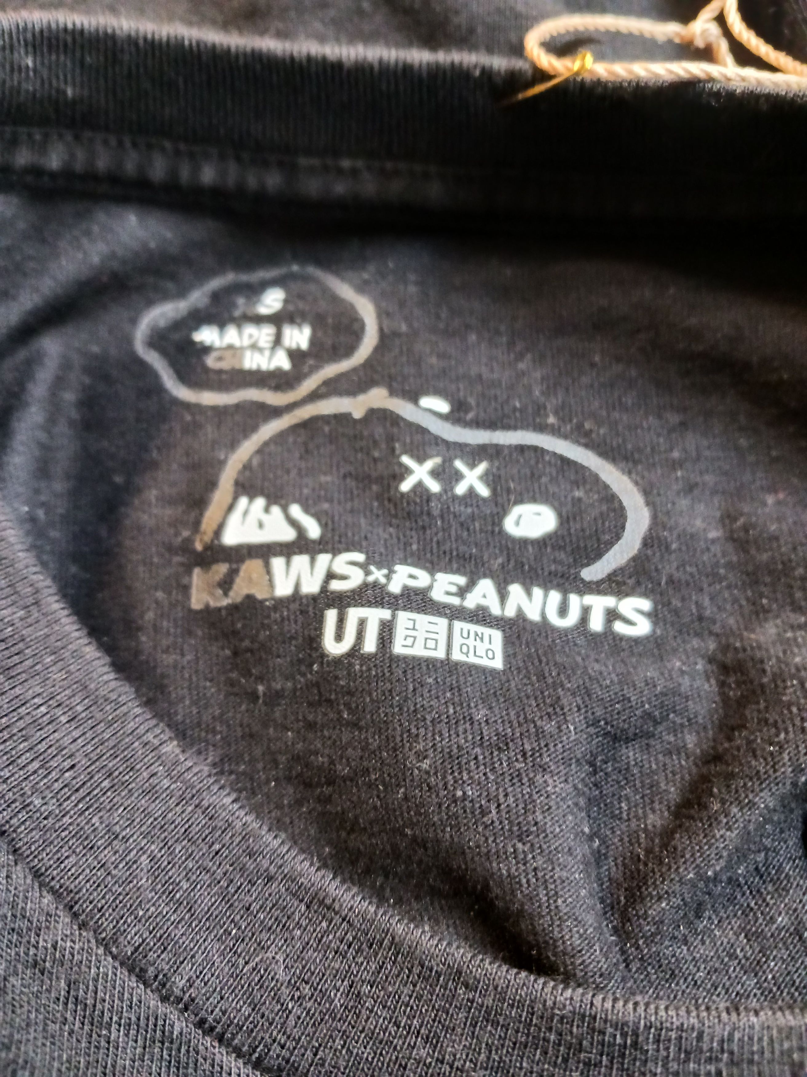 Kaws × Peanuts KAWS x Peanuts "Joe Kaws" Embroidered Pocket Tee Black -XS Size US XS / EU 42 / 0 - 8 Thumbnail