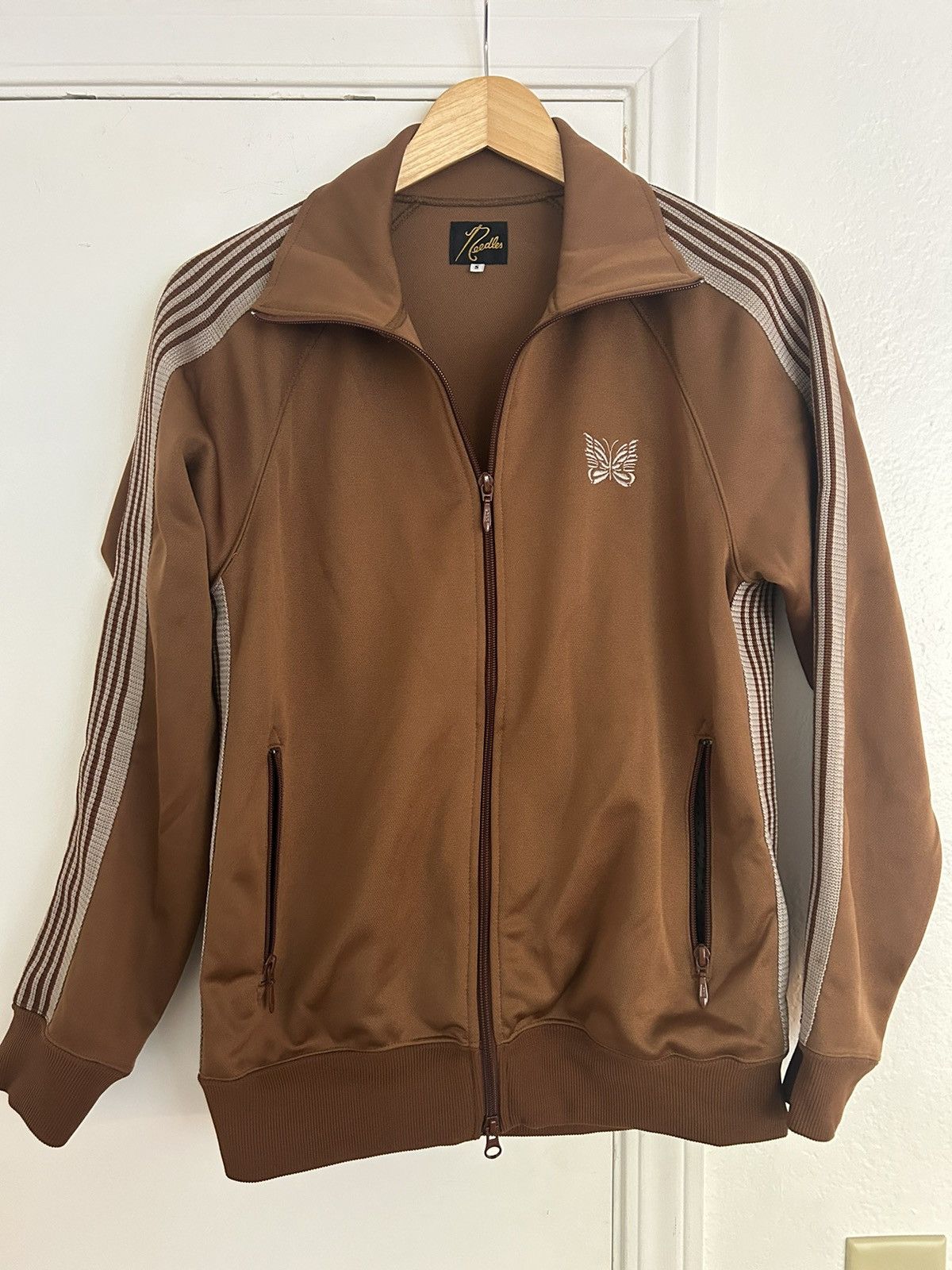 ジャケット・アウター NEEDLES Track Jacket Faux Lthr./Brown NEEDLES Track Jacket Faux Lthr./Brown