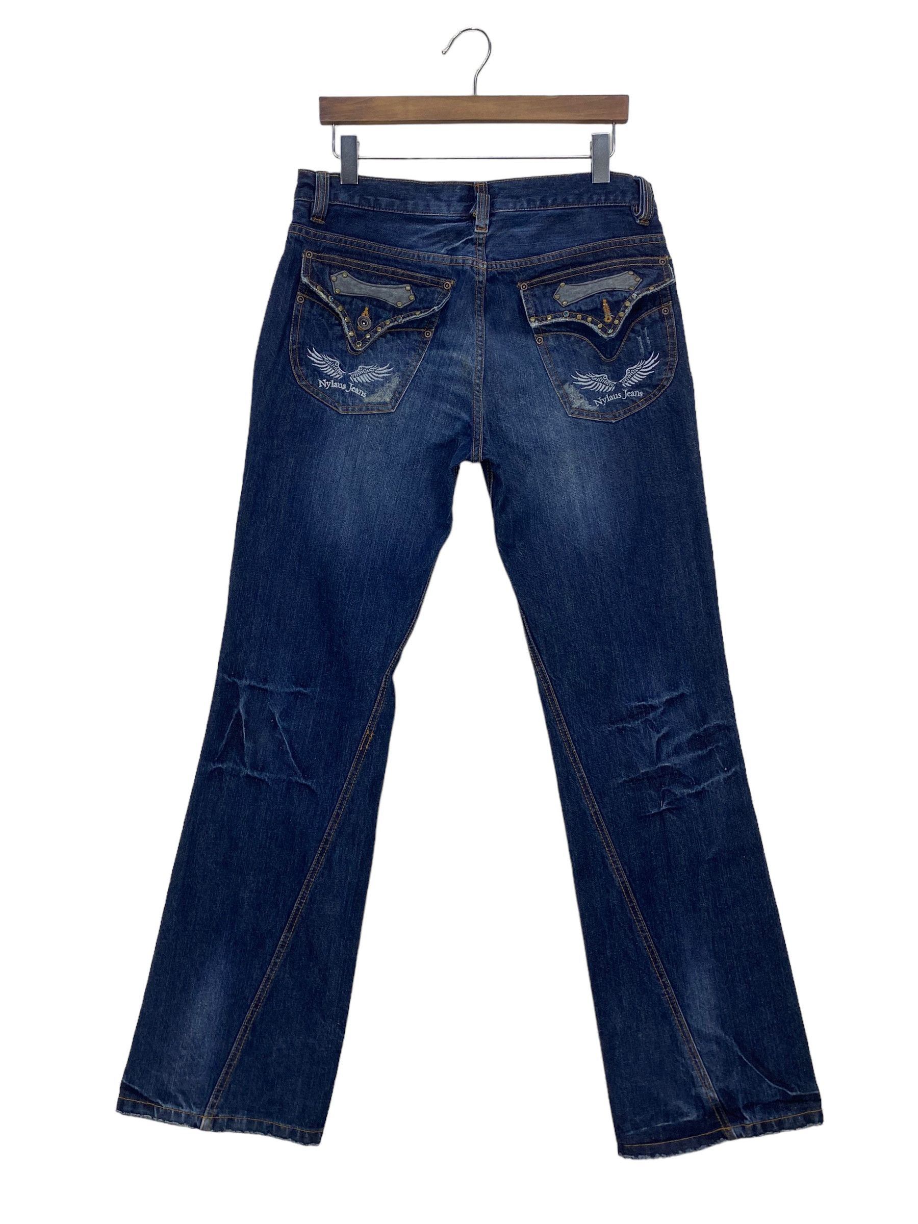 image of Distressed Denim x Rockers Nylaus Jeans Twisted Seam Flare Jeans Punk Grunge Jeans in Blue (Size 30