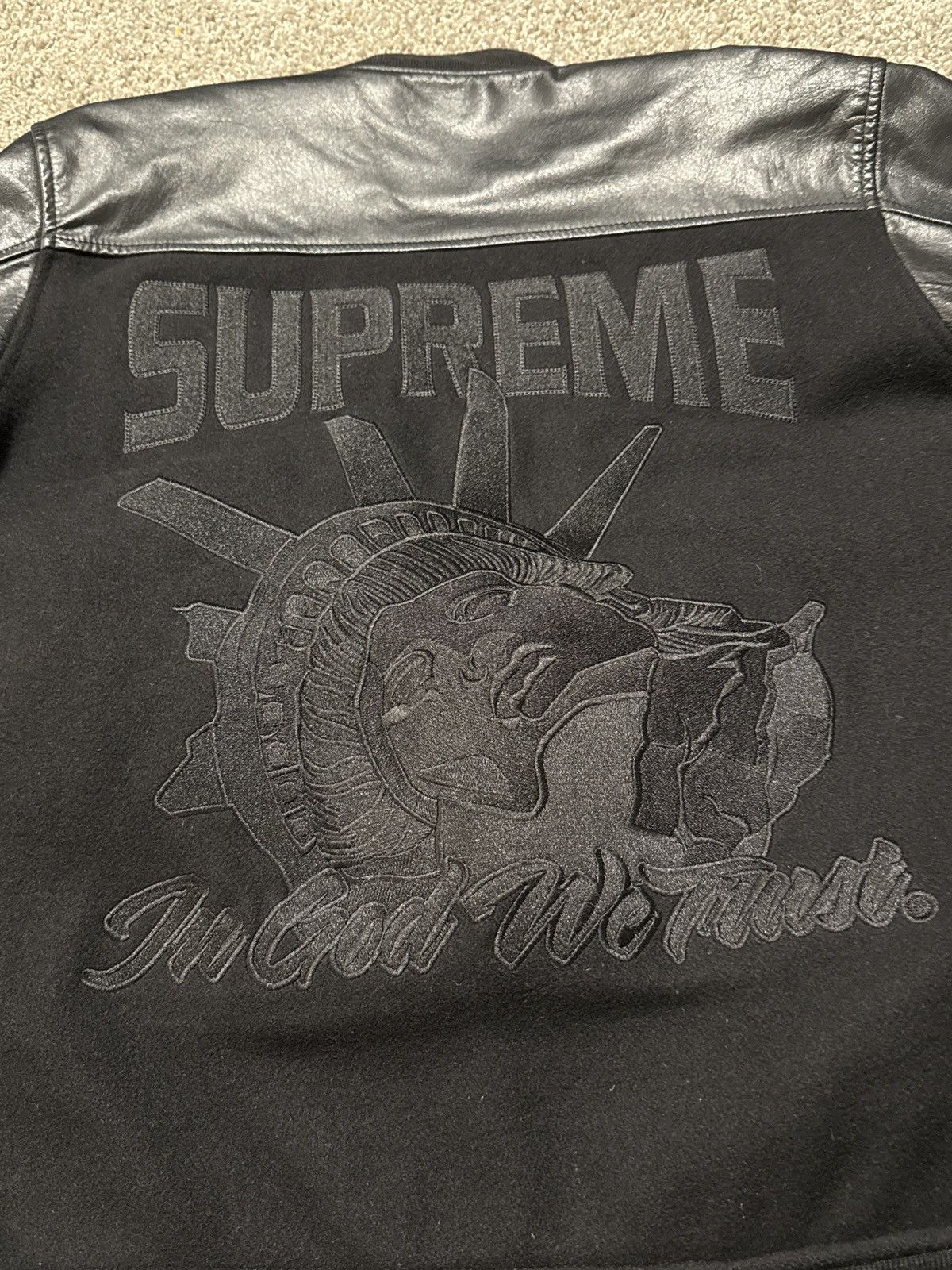 Supreme “In god we trust” varsity jacket