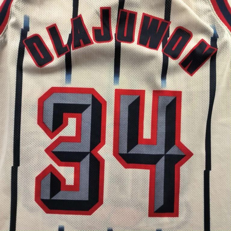 Champion Houston Rockets Olajuwon Champion EU home NBA jersey size L Size US L / EU 52-54 / 3 - 7 Thumbnail