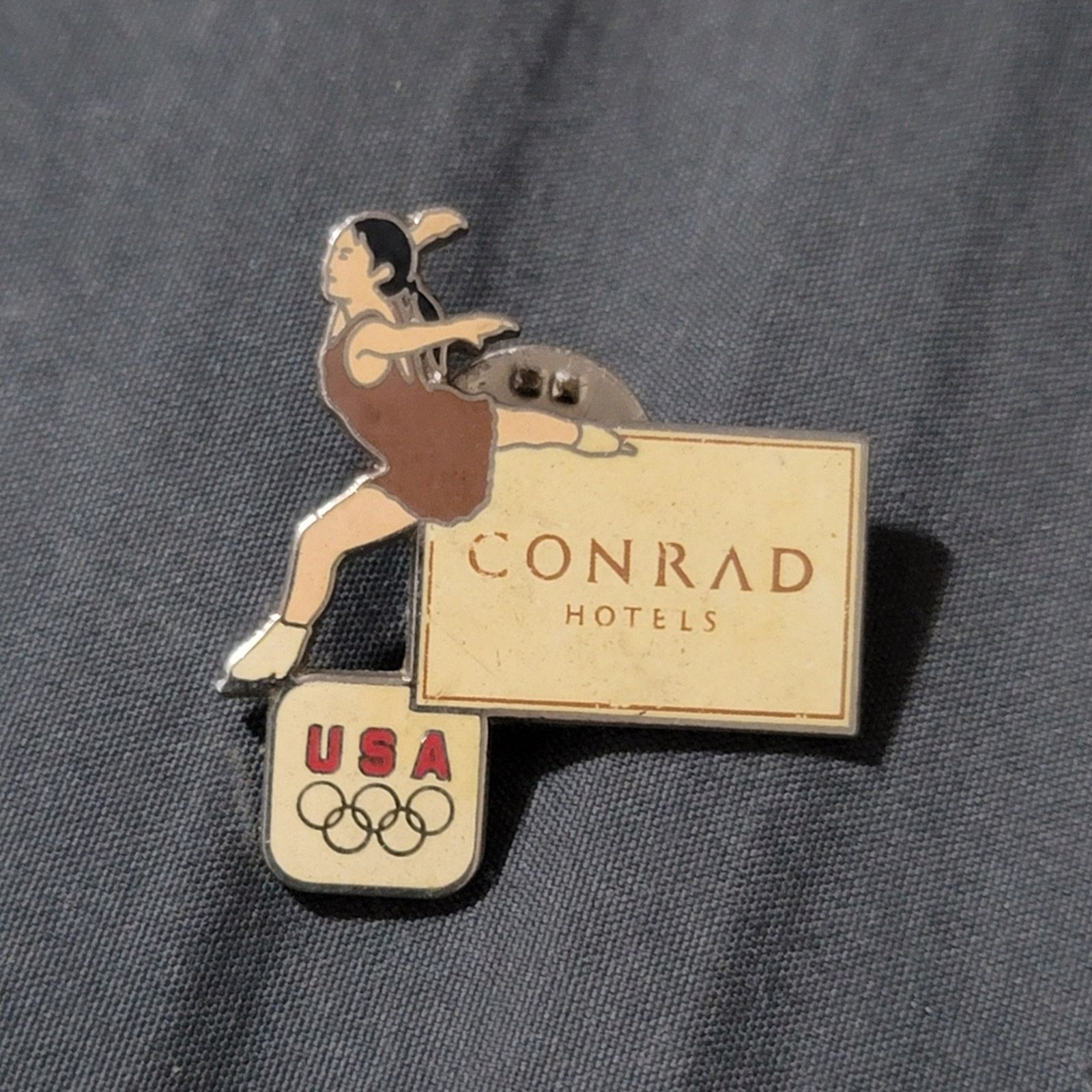 USA Olympics Vtg USA Olympics Ice Figure Skating Conrad Hotels Lapel Pin Size ONE SIZE - 1 Thumbnail